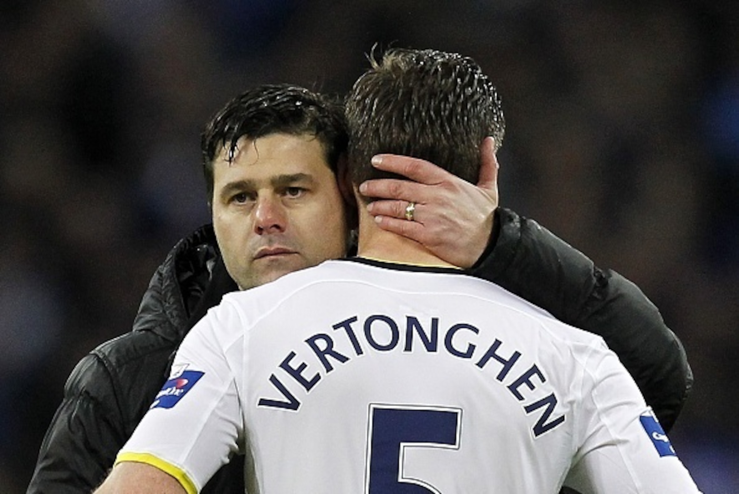 Tottenham Hotspur's Argentinian Head Coach Mauricio Pochettino consoles Tottenham Hotspur's Belgian defender Jan Vertonghen at the final whistle in the English League Cup Final football match between Chelsea and Tottenham Hotspur at Wembley Stadium in nor