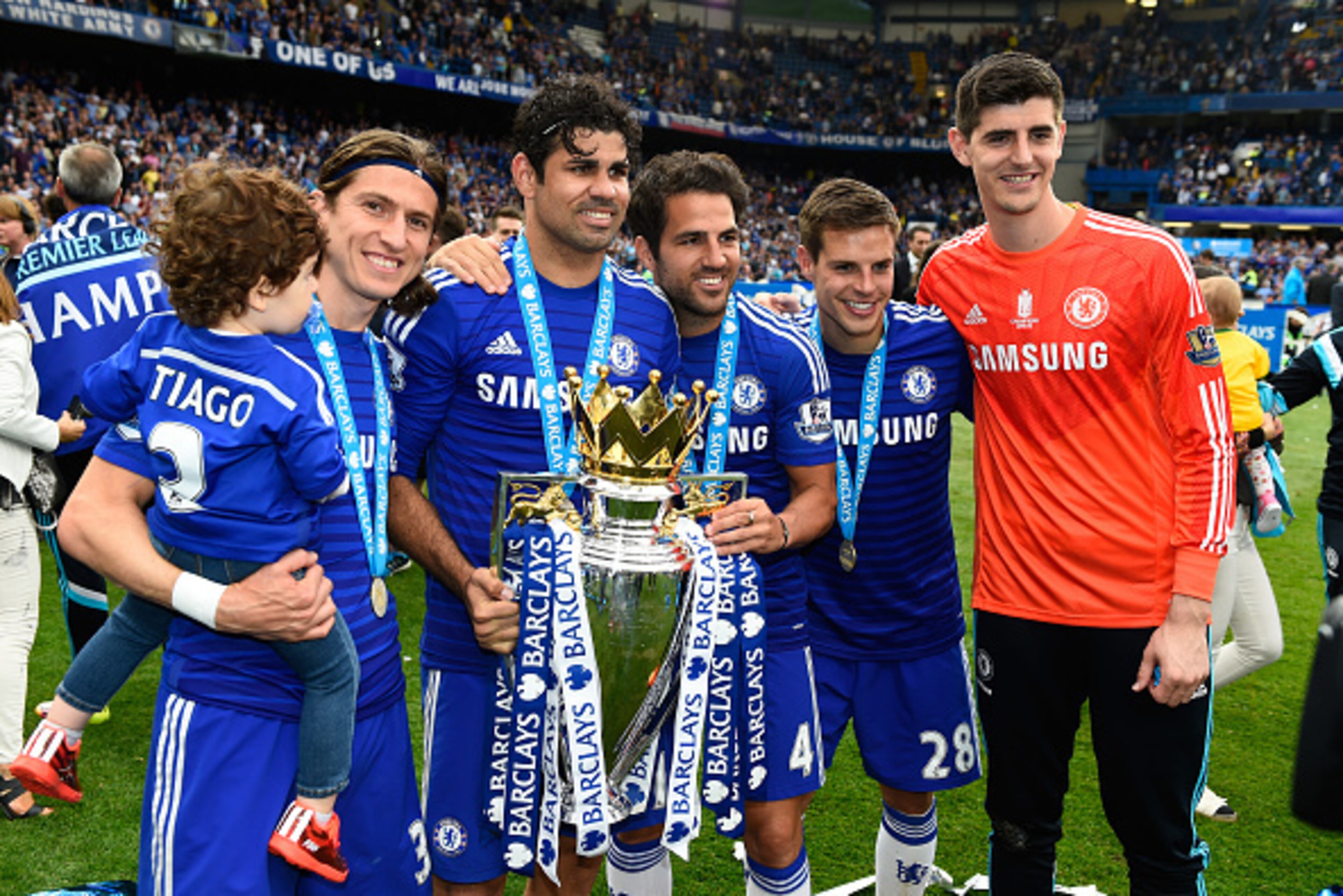 LONDON, ENGLAND - MAY 24:  (L-R) Filipe Luis, Diego Costa, Cesc Fabregas, Cesar Azpilicueta and Thibaut Courtois of Chelsea celebrate with the trophy after the Barclays Premier League match between Chelsea and Sunderland at Stamford Bridge on May 24, 2015