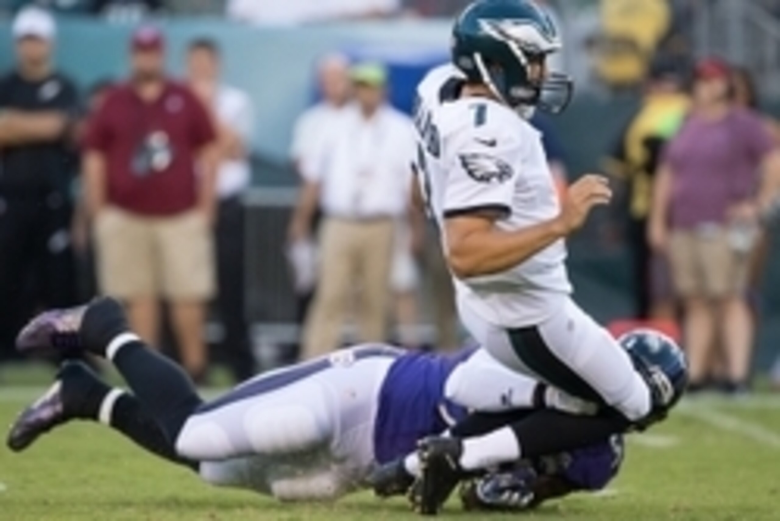 Aug 22, 2015; Philadelphia, PA, USA; Baltimore Ravens outside linebacker Terrell Suggs (55) tackles Philadelphia Eagles quarterback Sam Bradford (7) late and is called for a penalty during the first quarter at Lincoln Financial Field. Mandatory Credit: Bi