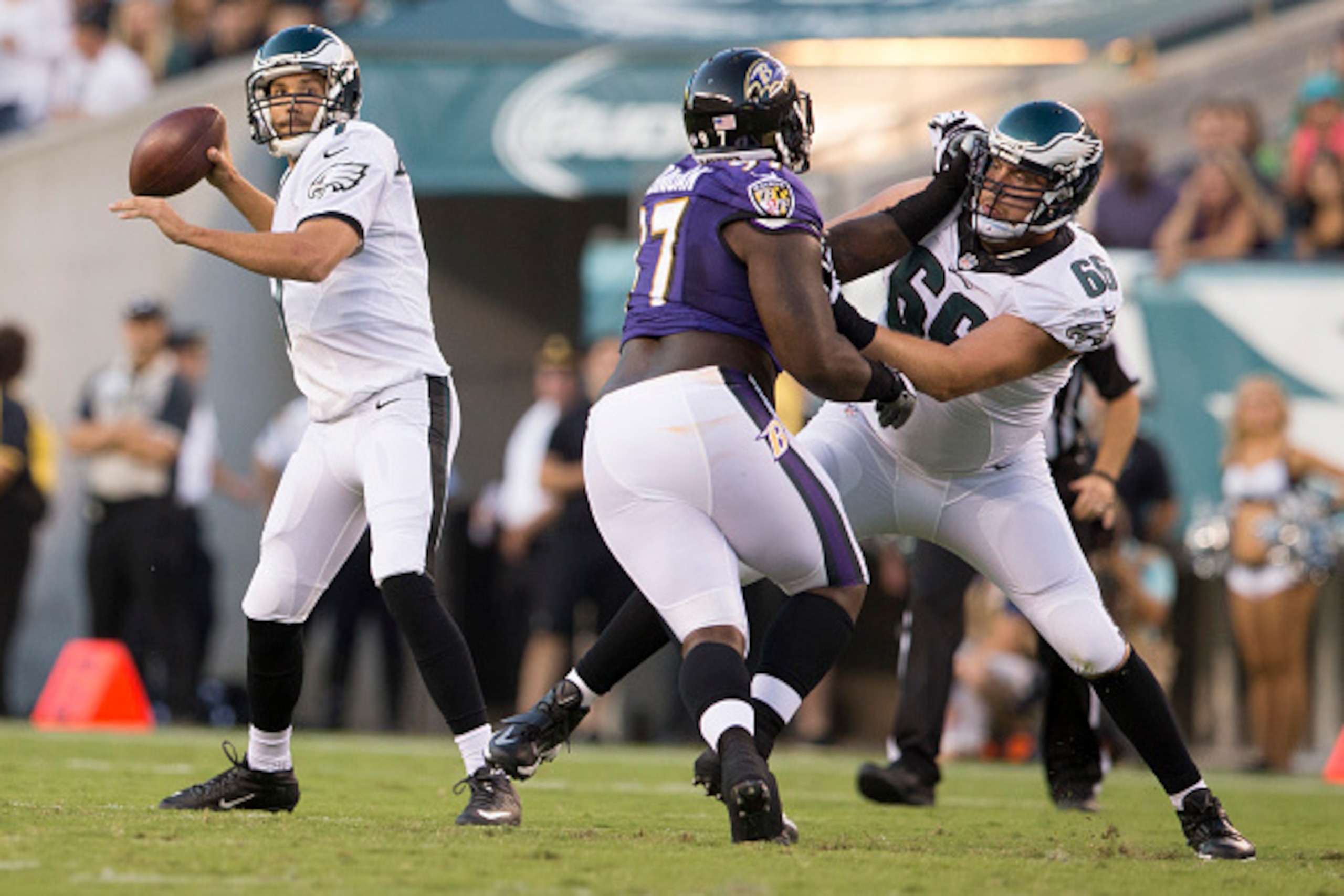 PHILADELPHIA, PA - AUGUST 22: Andrew Gardner #66 of the Philadelphia Eagles blocks Timmy Jernigan #97 of the Baltimore Ravens as Sam Bradford #7 of the Philadelphia Eagles looks to pass the ball in the first quarter on August 22, 2015 at Lincoln Financial