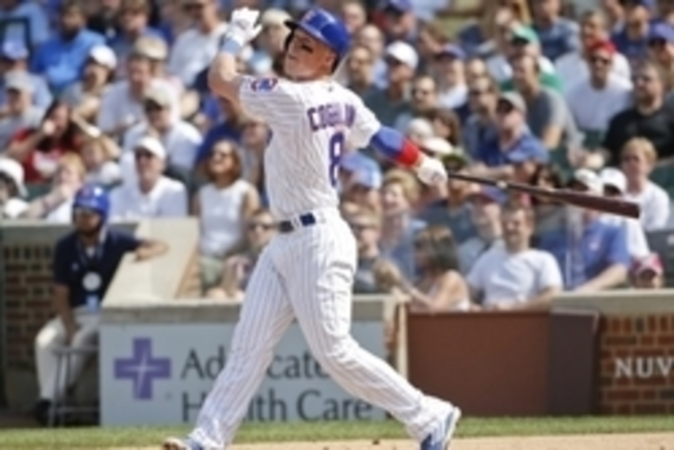 Aug 21, 2015; Chicago, IL, USA; Chicago Cubs left fielder Chris Coghlan (8) hits a home run against the Atlanta Braves in the first inning at Wrigley Field. Mandatory Credit: Kamil Krzaczynski-USA TODAY Sports