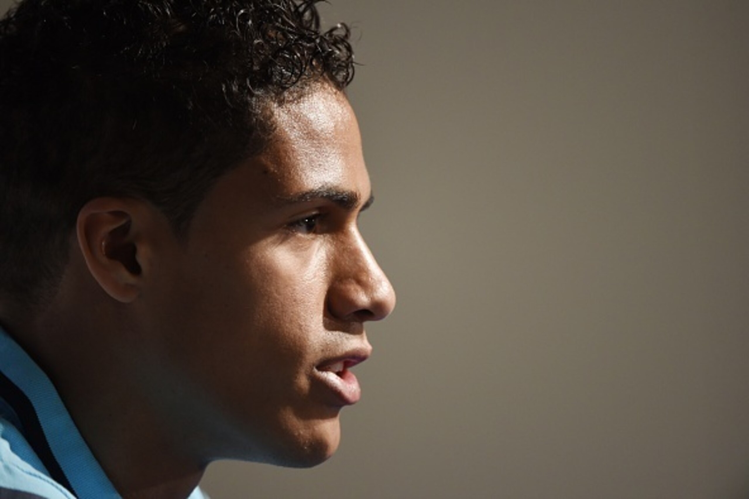 French defender Raphael Varane takes part in a press conference on June 5, 2015 in Clairefontaine-en-Yvelines, two days prior to the friendly football match between France and Belgium at the Stade-de-France in Saint-Denis outside Paris. AFP PHOTO / LOIC V