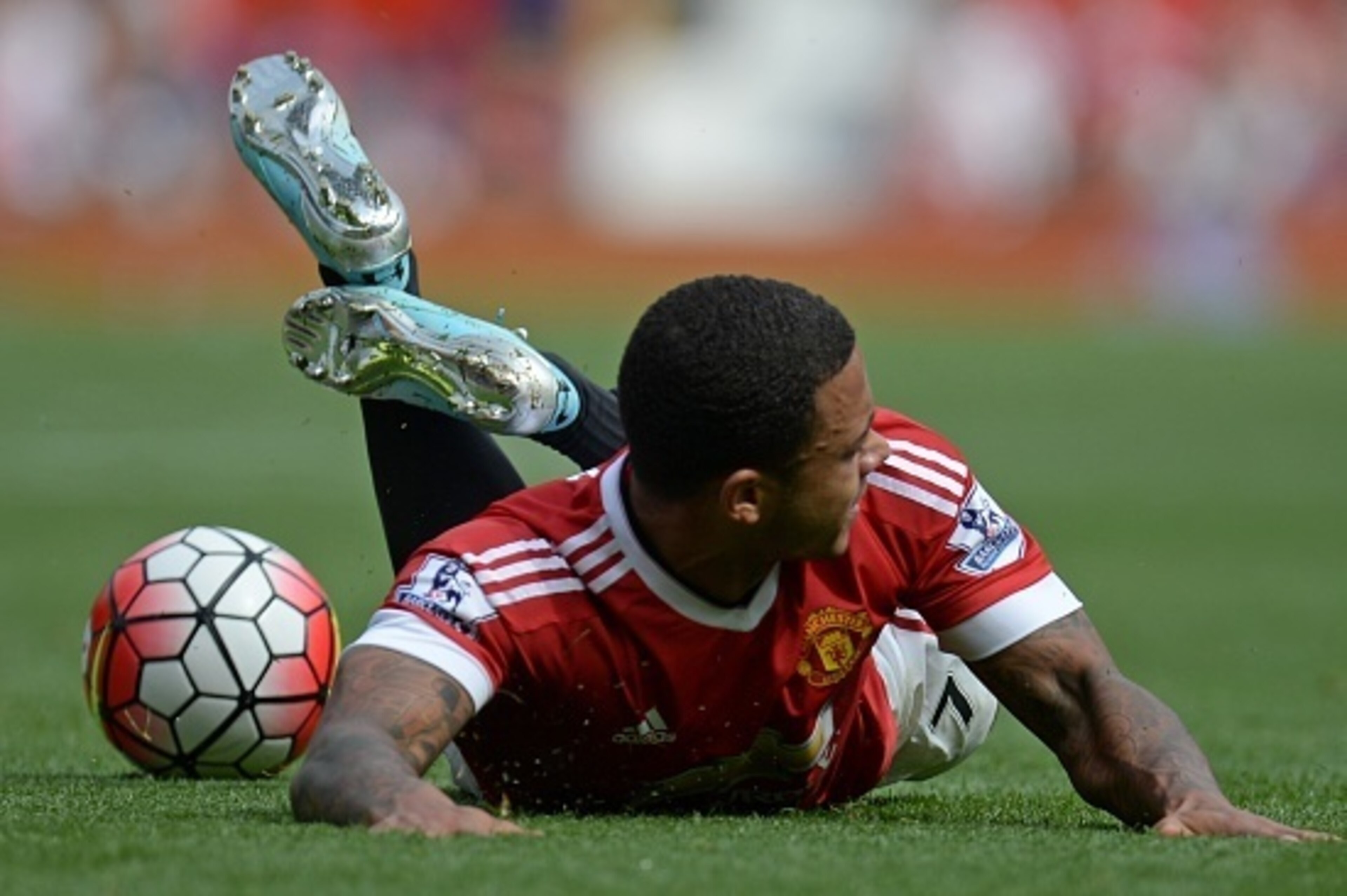 Manchester United's Dutch midfielder Memphis Depay is tripped up during the English Premier League football match between Manchester United and Newcastle United at Old Trafford in Manchester, north west England, on August 22, 2015. The game finished 0-0. 