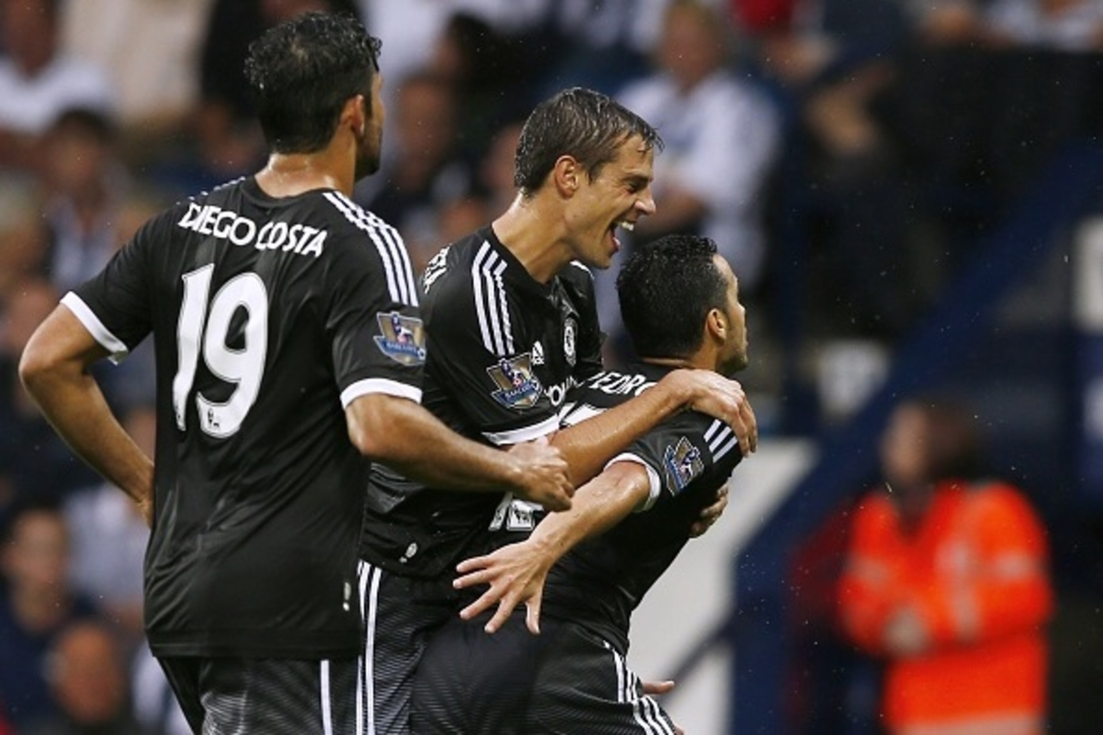 Chelsea's Spanish midfielder Pedro (R) celebrates scoring the opening goal with Chelsea's Spanish defender Cesar Azpilicueta (2nd R) and Chelsea's Brazilian-born Spanish striker Diego Costa during the English Premier League football match between West Br Chelsea's Spanish midfielder Pedro (R) celebrates scoring the opening goal with Chelsea's Spanish defender Cesar Azpilicueta (2nd R) and Chelsea's Brazilian-born Spanish striker Diego Costa during the English Premier League football match between West Br