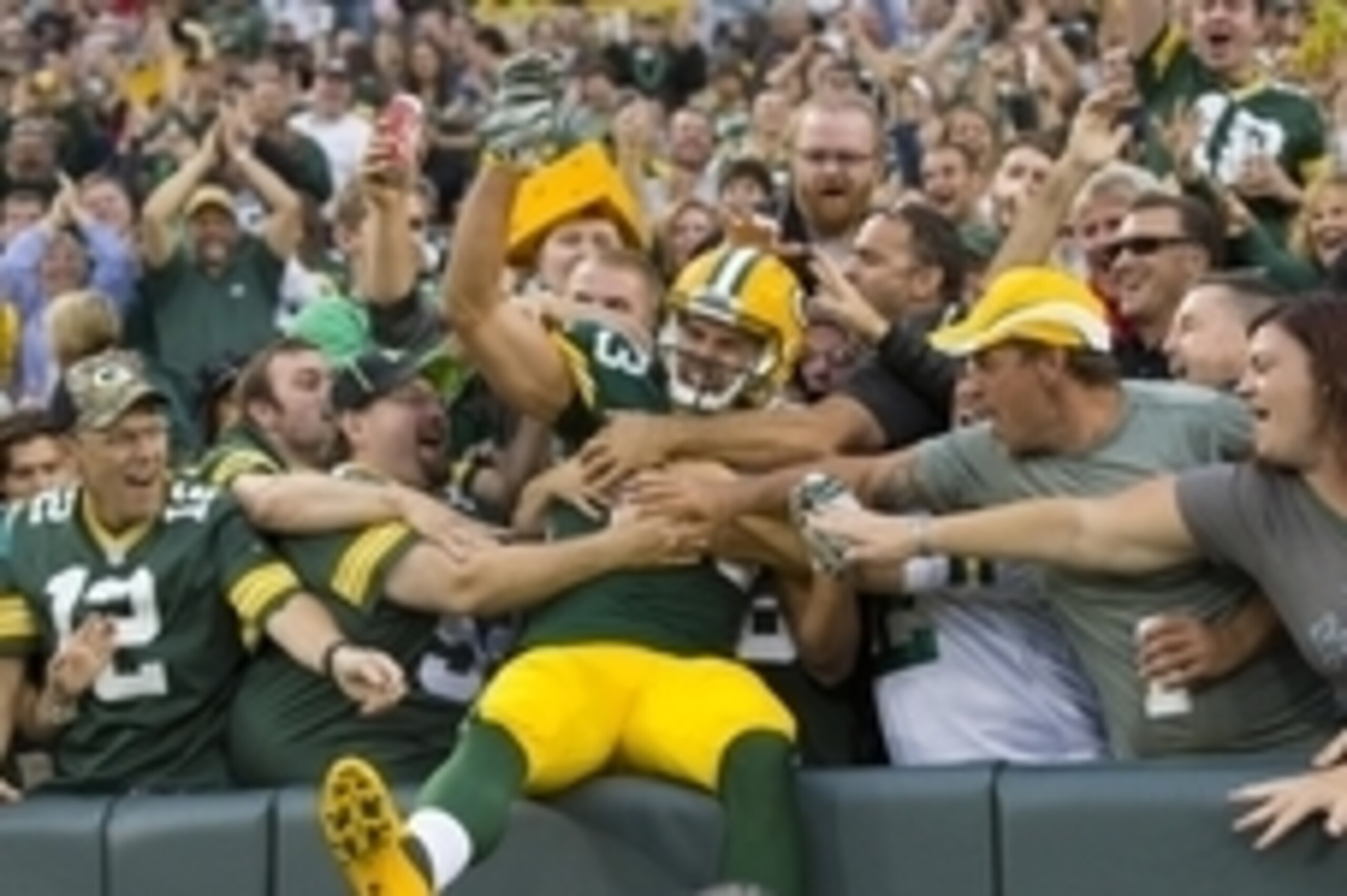 Aug 28, 2014; Green Bay, WI, USA; Green Bay Packers wide receiver Jeff Janis (83) celebrates a touchdown catch by jumping into the stands during the second quarter against the Kansas City Chiefs at Lambeau Field. Mandatory Credit: Jeff Hanisch-USA TODAY S