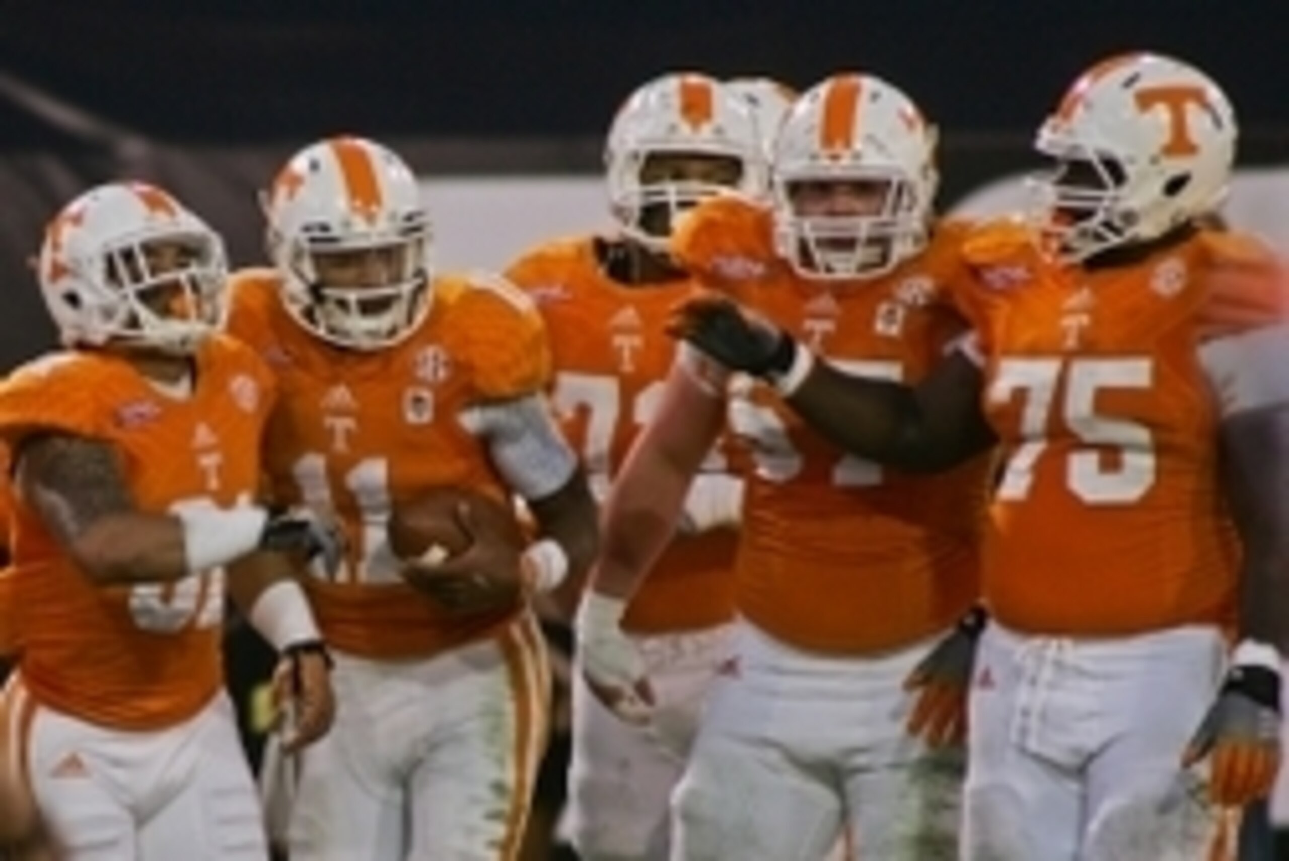 Jan 2, 2015; Jacksonville, FL, USA; Tennessee Volunteers quarterback Joshua Dobbs (second from left) is congratulated by wide receiver Johnathon Johnson (81) and guard Jashon Robertson (73) and center Mack Crowder (57) and offensive lineman Marcus Jackson Jan 2, 2015; Jacksonville, FL, USA; Tennessee Volunteers quarterback Joshua Dobbs (second from left) is congratulated by wide receiver Johnathon Johnson (81) and guard Jashon Robertson (73) and center Mack Crowder (57) and offensive lineman Marcus Jackson