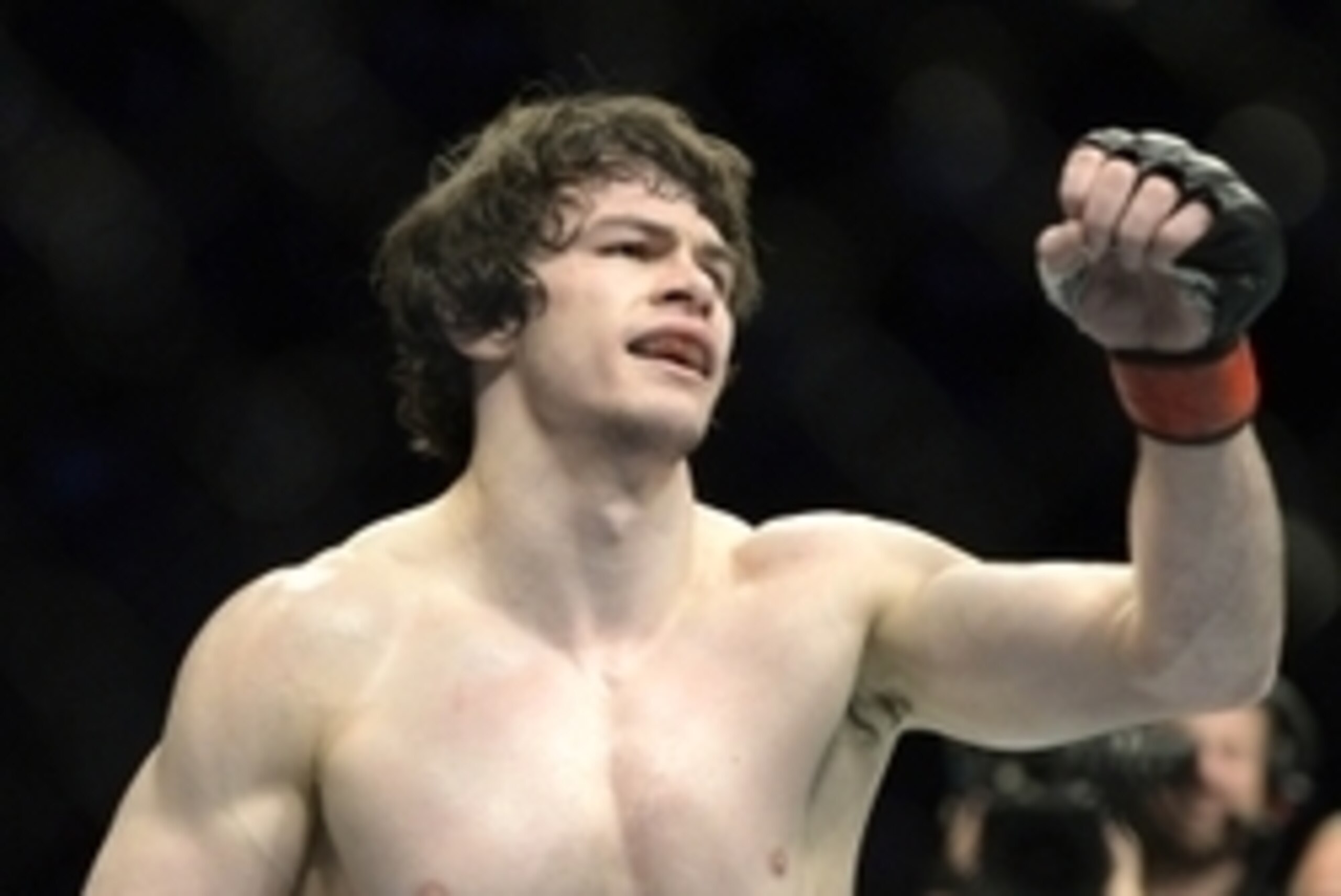 Apr 25, 2015; Montreal, Quebec, CAN; Olivier Aubin-Mercier (red) reacts after his fight against David Michaud (blue) (not pictured) during their lightweight bout during UFC 186 at Bell Centre. Mandatory Credit: Eric Bolte-USA TODAY Sports