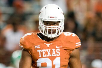 AUSTIN, TX - AUGUST 30:  Bryce Cottrell #91 of the Texas Longhorns looks on against the North Texas Mean Green on August 30, 2014 at Darrell K Royal-Texas Memorial Stadium in Austin, Texas.  (Photo by Cooper Neill/Getty Images)