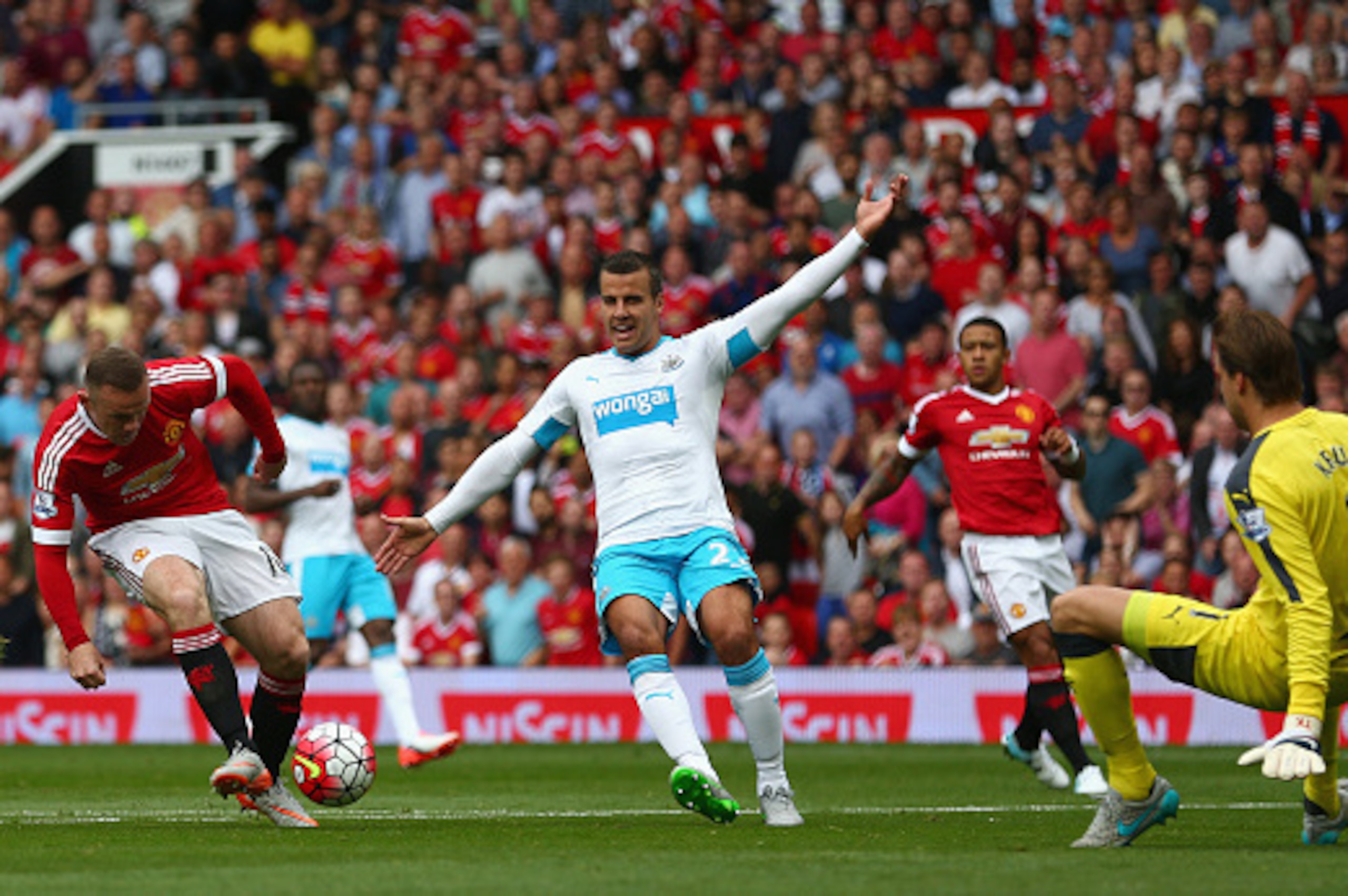 MANCHESTER, ENGLAND - AUGUST 22:  Wayne Rooney of Manchester United shoots at goal during the Barclays Premier League match between Manchester United and Newcastle United at Old Trafford on August 22, 2015 in Manchester, England.  (Photo by Clive Brunskil