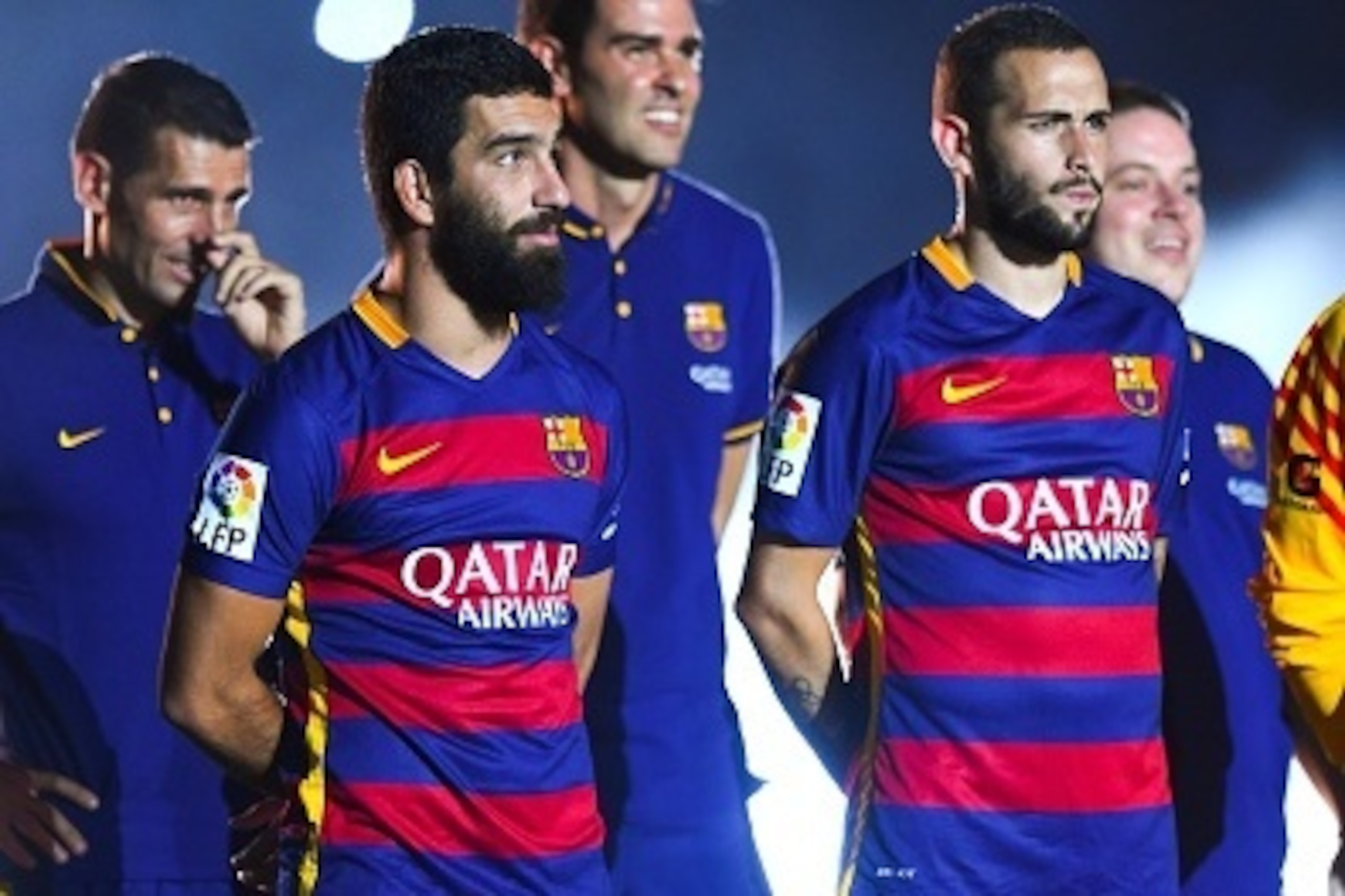 BARCELONA, SPAIN - AUGUST 05:  Arda Turan (L) and Aleix Vidal of FC Barcelona look on during the team official presentation ahead of the Joan Gamper trophy match at Camp Nou on August 5, 2015 in Barcelona, Spain.  (Photo by David Ramos/Getty Images)
