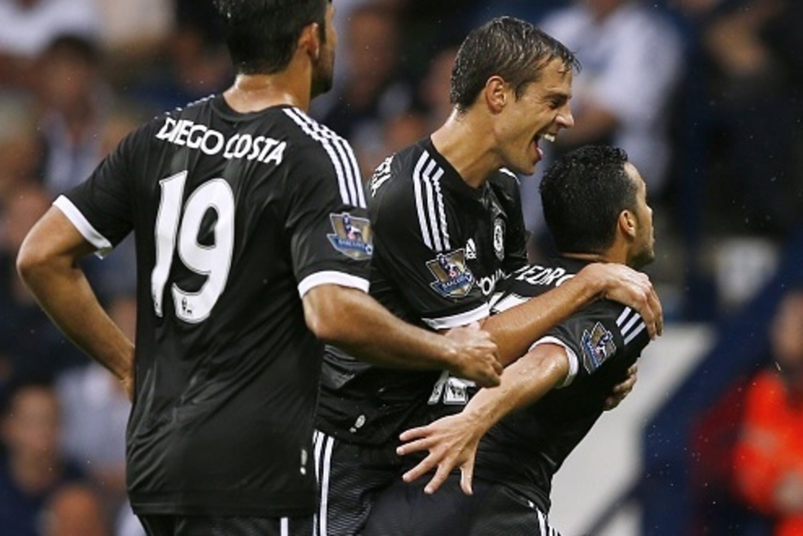 Chelsea's Spanish midfielder Pedro (R) celebrates scoring the opening goal with Chelsea's Spanish defender Cesar Azpilicueta (2nd R) and Chelsea's Brazilian-born Spanish striker Diego Costa during  the English Premier League football match between West Br