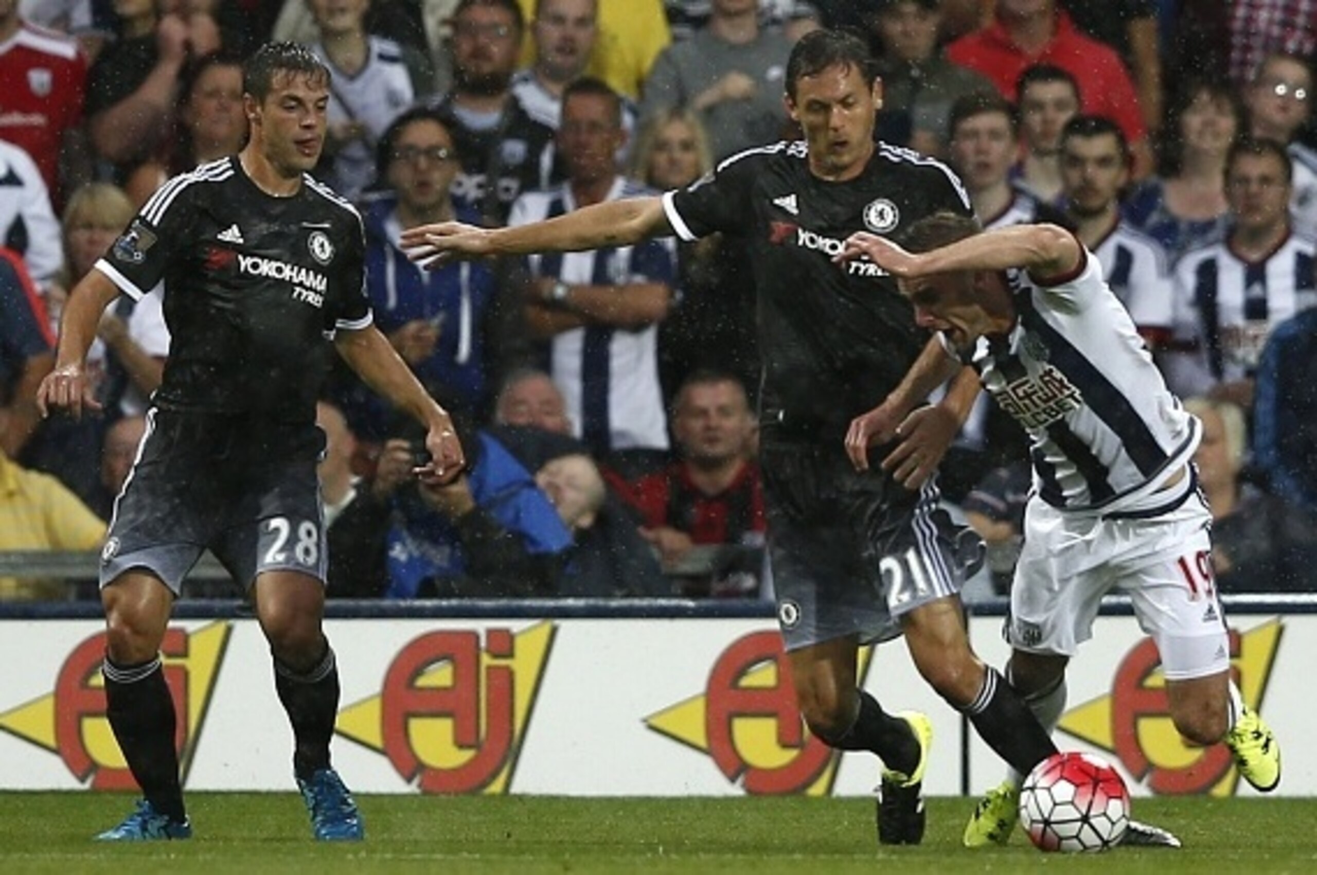 West Bromwich Albion's English midfielder Callum McManaman (R) is tripped in the area by Chelsea's Serbian midfielder Nemanja Matic (2nd R) resulting in a penalty during the English Premier League football match between West Bromwich Albion and Chelsea at
