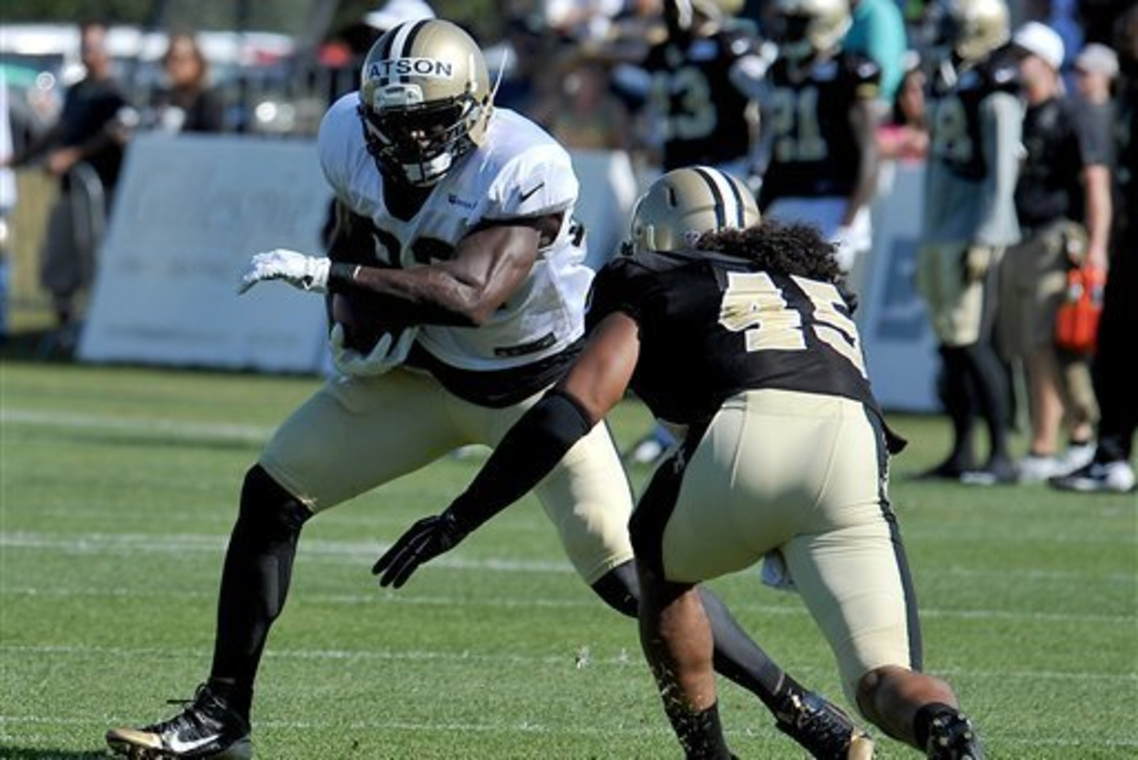 Benjamin Watson eludes rookie Hau'oli Kikaha in practice.