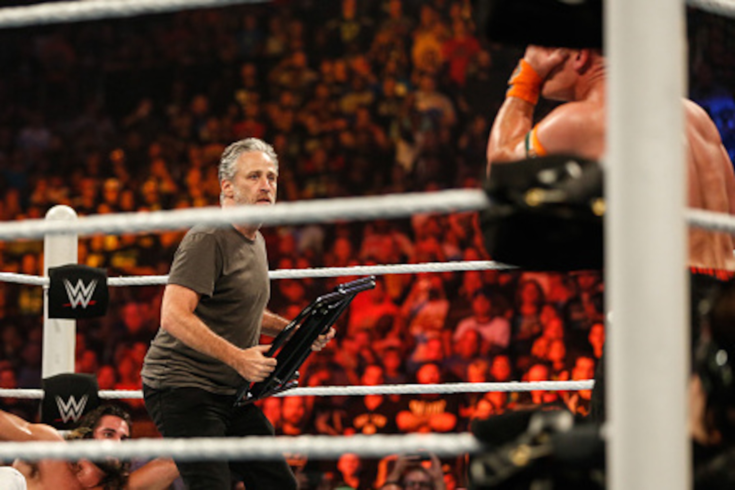 NEW YORK, NY - AUGUST 23:  Jon Stewart gets into the action at WWE SummerSlam 2015 Barclays Center of Brooklyn on August 23, 2015 in New York City.  (Photo by JP Yim/Getty Images)