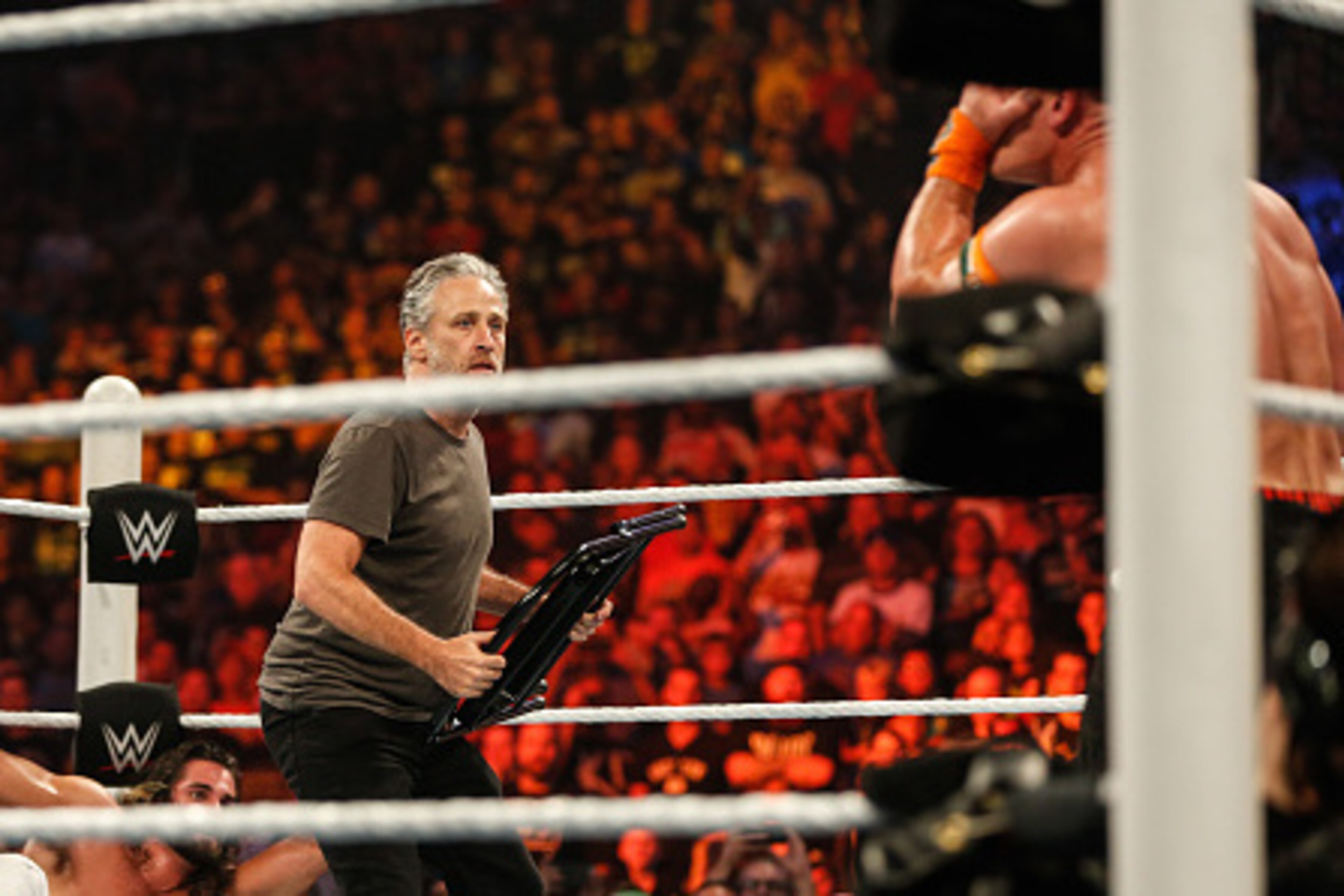 NEW YORK, NY - AUGUST 23:  Jon Stewart gets into the action at WWE SummerSlam 2015 Barclays Center of Brooklyn on August 23, 2015 in New York City.  (Photo by JP Yim/Getty Images)