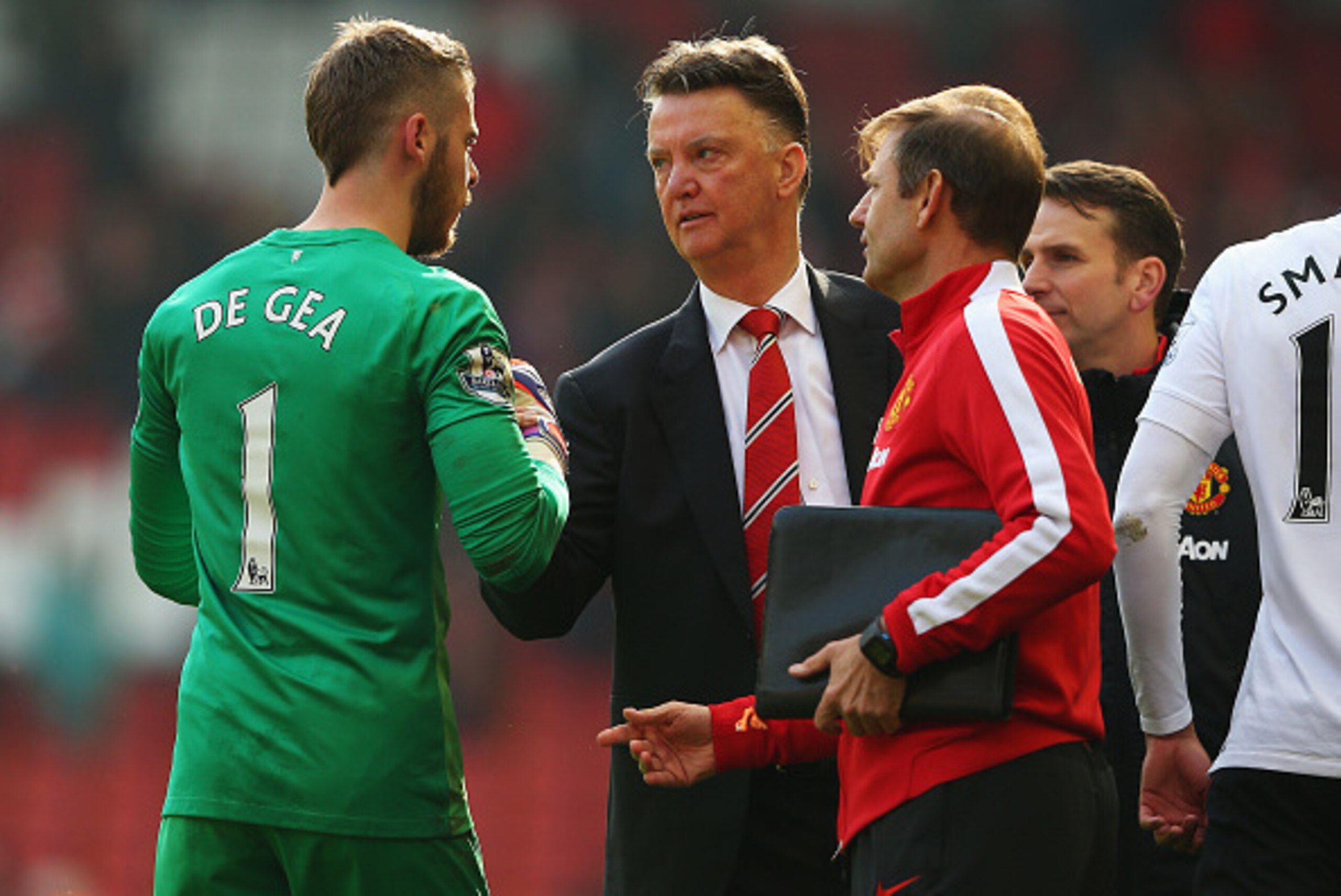 LIVERPOOL, ENGLAND - MARCH 22:  Louis van Gaal, manager of Manchester United celebrates victory with David De Gea of Manchester United after the Barclays Premier League match between Liverpool and Manchester United at Anfield on March 22, 2015 in Liverpoo