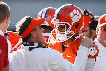 CLEMSON, SC - NOVEMBER 29: Offensive Coordinator Chad Morris of the Clemson Tigers reacts with Deshaun Watson #4 after Watson scored a touchdown during their game against the South Carolina Gamecocks at Memorial Stadium on November 29, 2014 in Clemson, So