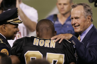 Horn with former President George H. W. Bush at the Saints' 2005 "home opener" in New York.