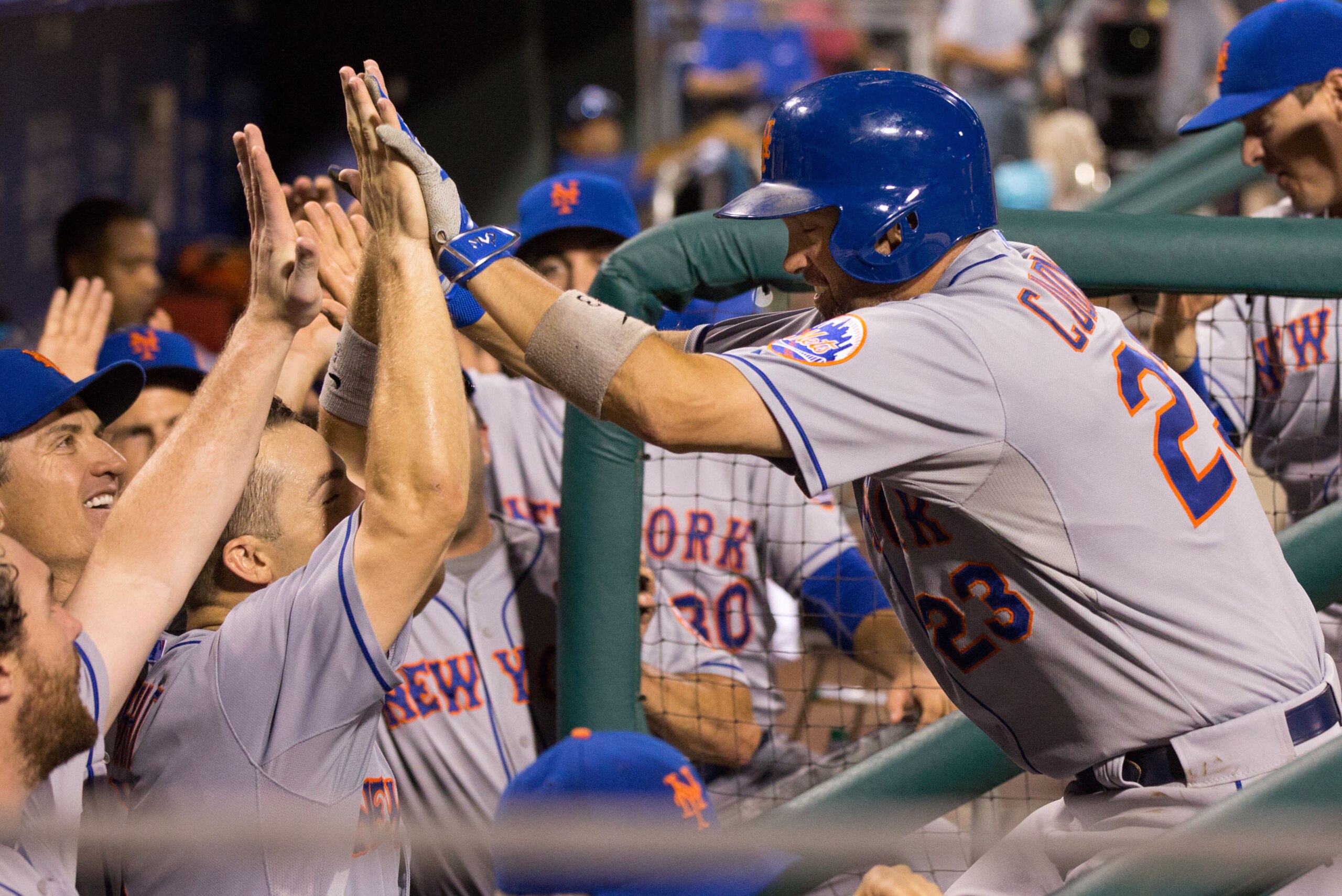 Aug 24, 2015; Philadelphia, PA, USA; New York Mets left fielder Michael Cuddyer (23) celebrates in the dugout after hitting a home run during the fifth inning against the Philadelphia Phillies at Citizens Bank Park. Mandatory Credit: Bill Streicher-USA TO Aug 24, 2015; Philadelphia, PA, USA; New York Mets left fielder Michael Cuddyer (23) celebrates in the dugout after hitting a home run during the fifth inning against the Philadelphia Phillies at Citizens Bank Park. Mandatory Credit: Bill Streicher-USA TO