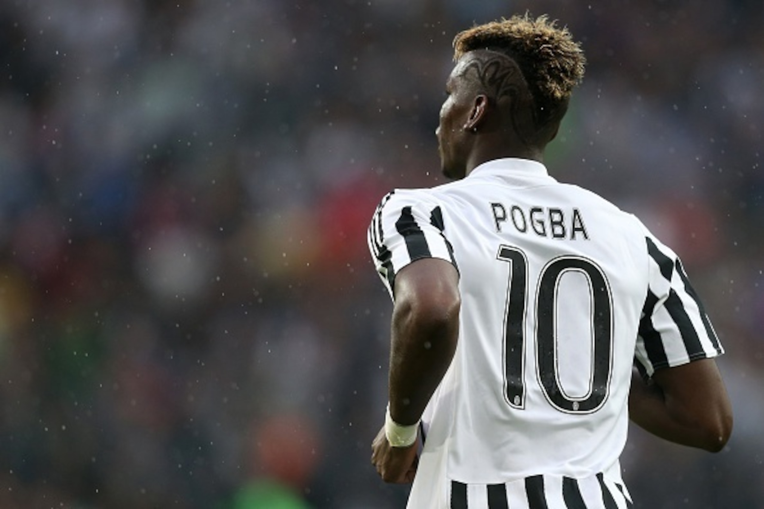 Juventus' midfielder from France Paul Pogba runs during the Italian Serie A football match Juventus Vs Udinese on August 23, 2015 at the 'Juventus Stadium' in Turin.  AFP PHOTO / MARCO BERTORELLO        (Photo credit should read MARCO BERTORELLO/AFP/Getty