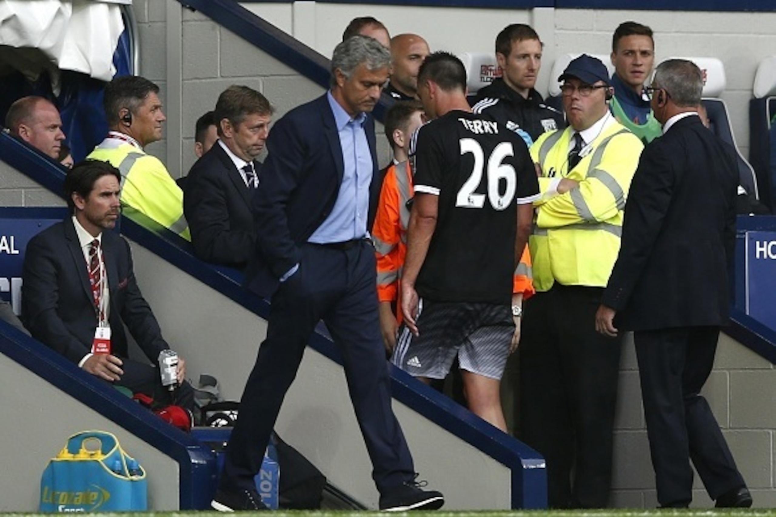 Chelsea's English defender John Terry (C) walks off the pitch after receiving a red card during the English Premier League football match between West Bromwich Albion and Chelsea at The Hawthorns in West Bromwich, central England on August 23, 2015. AFP P