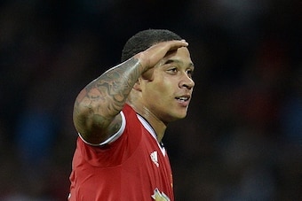 Manchester United's Dutch midfielder Memphis Depay celebrates after scoring his team's second goal during the UEFA Champions League play off football match between Manchester United and Club Brugge at Old Trafford in Manchester, north west England, on Aug Manchester United's Dutch midfielder Memphis Depay celebrates after scoring his team's second goal during the UEFA Champions League play off football match between Manchester United and Club Brugge at Old Trafford in Manchester, north west England, on Aug