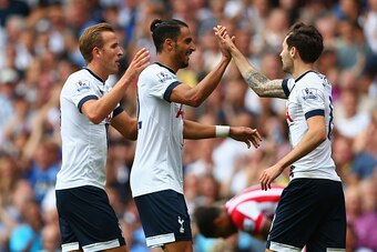 LONDON, ENGLAND - AUGUST 15:  Nacer Chadli (C) of Tottenham Hotspur celebrates scoring his team's second goal with his team mates Harry Kane (L) and Ryan Mason (R) during the Barclays Premier League match between Tottenham Hotspur and Stoke City at White 