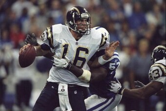 4 Oct 1998:  Quarterback Ryan Leaf #16 of the San Diego Chargers is sacked from behind by Bertran Berry #57 of the Indianapolis Colts during a game at the RCA Dome in Indianapolis, Indiana. The Colts defeated the Chargers 17-12.