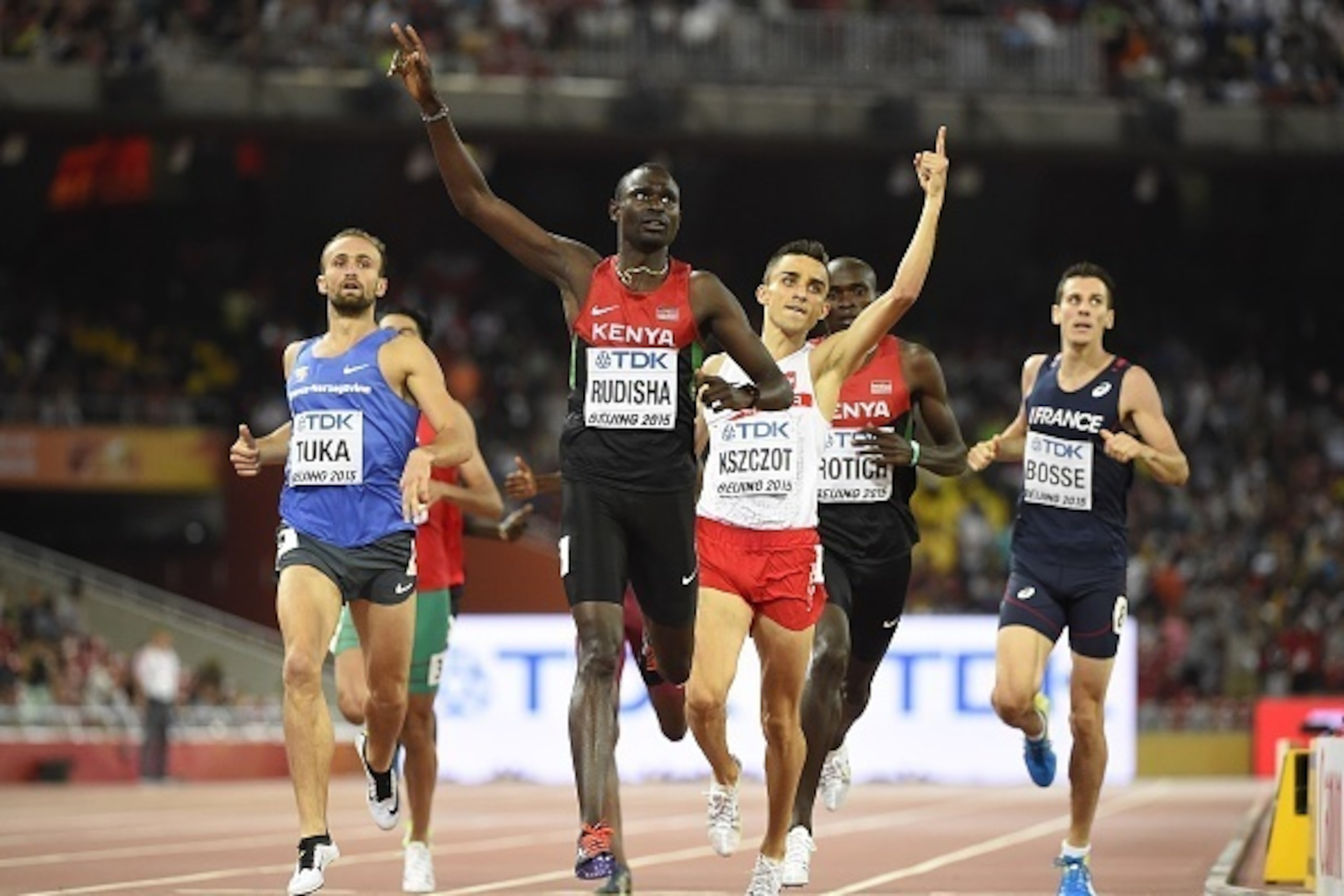 Kenya's David Lekuta Rudisha (C) celebrates as he wins in front of Bosnia-Herzegovina's Amel Tuka (L) and Poland's Adam Kszczot (centre R) in the final of the men's 800 metres athletics event at the 2015 IAAF World Championships at the 'Bird's Nest' Natio