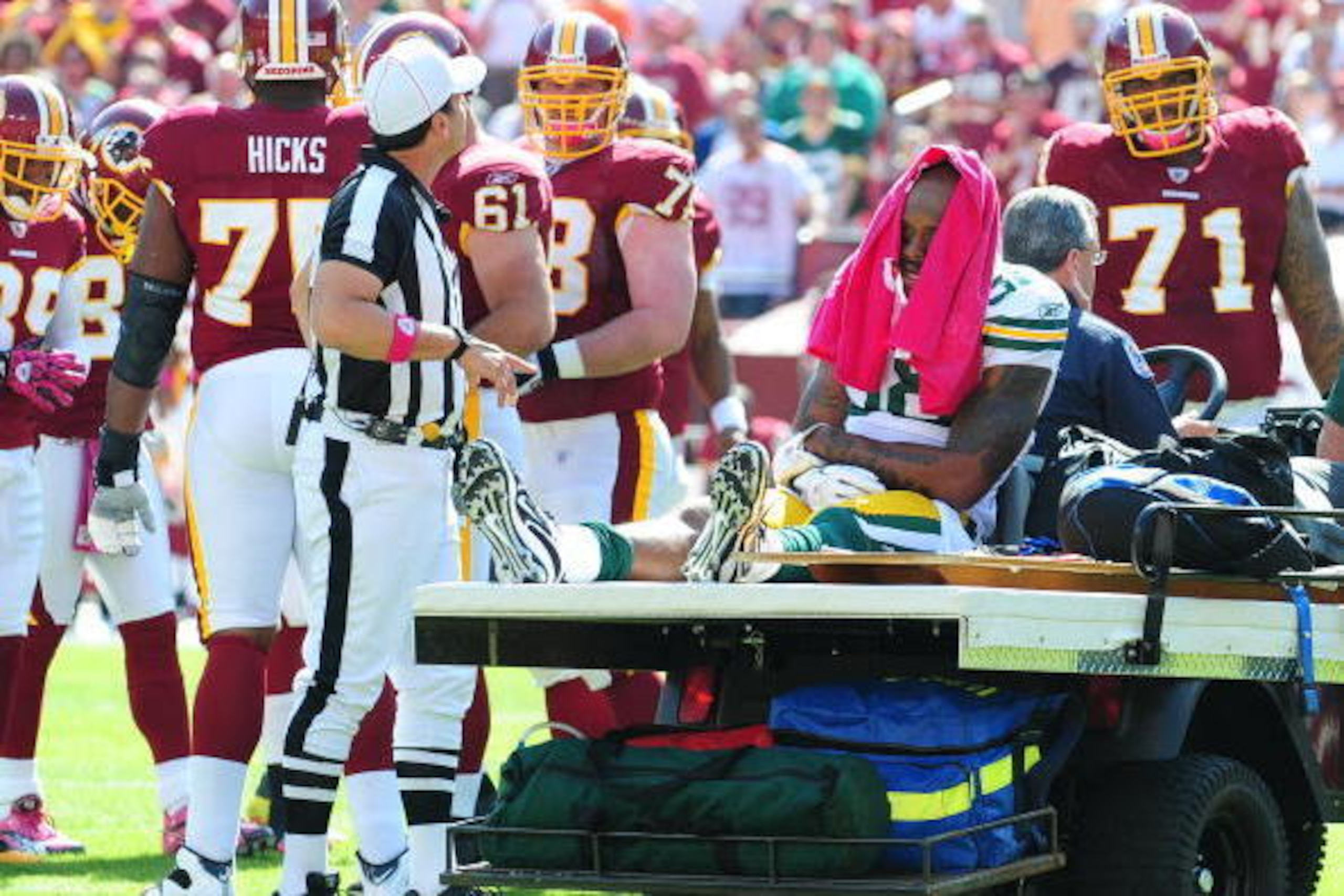 LANDOVER, MD - OCTOBER 10: Jermichael Finley #88 of the Green Bay Packers is carted off the field after an injury against the Washington Redskins at FedEx Field on October 10, 2010 in Landover, Maryland. The Redskins defeated the Packers 16-13 in overtime
