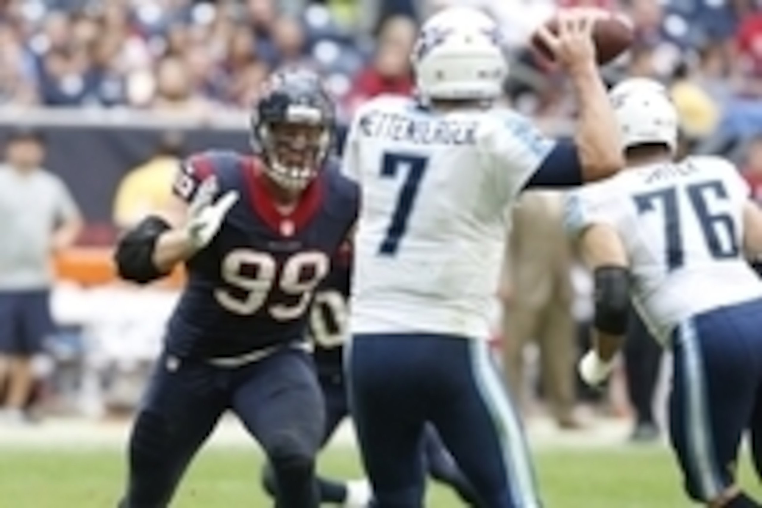 Nov 30, 2014; Houston, TX, USA; Tennessee Titans quarterback Zach Mettenberger (7) throws in the pocket under pressure from Houston Texans defensive end J.J. Watt (99) in the third quarter at NRG Stadium. Mettenberger was injured on the play. Mandatory Cr Nov 30, 2014; Houston, TX, USA; Tennessee Titans quarterback Zach Mettenberger (7) throws in the pocket under pressure from Houston Texans defensive end J.J. Watt (99) in the third quarter at NRG Stadium. Mettenberger was injured on the play. Mandatory Cr