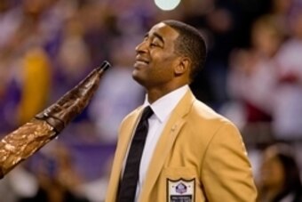 Nov 7, 2013; Minneapolis, MN, USA; Hall of Fame wide receiver Cris Carter smiles during a moment honoring him before the game between the Washington Redskins and the Minnesota Vikings at Mall of America Field at H.H.H. Metrodome. The Vikings win 34-27. Ma