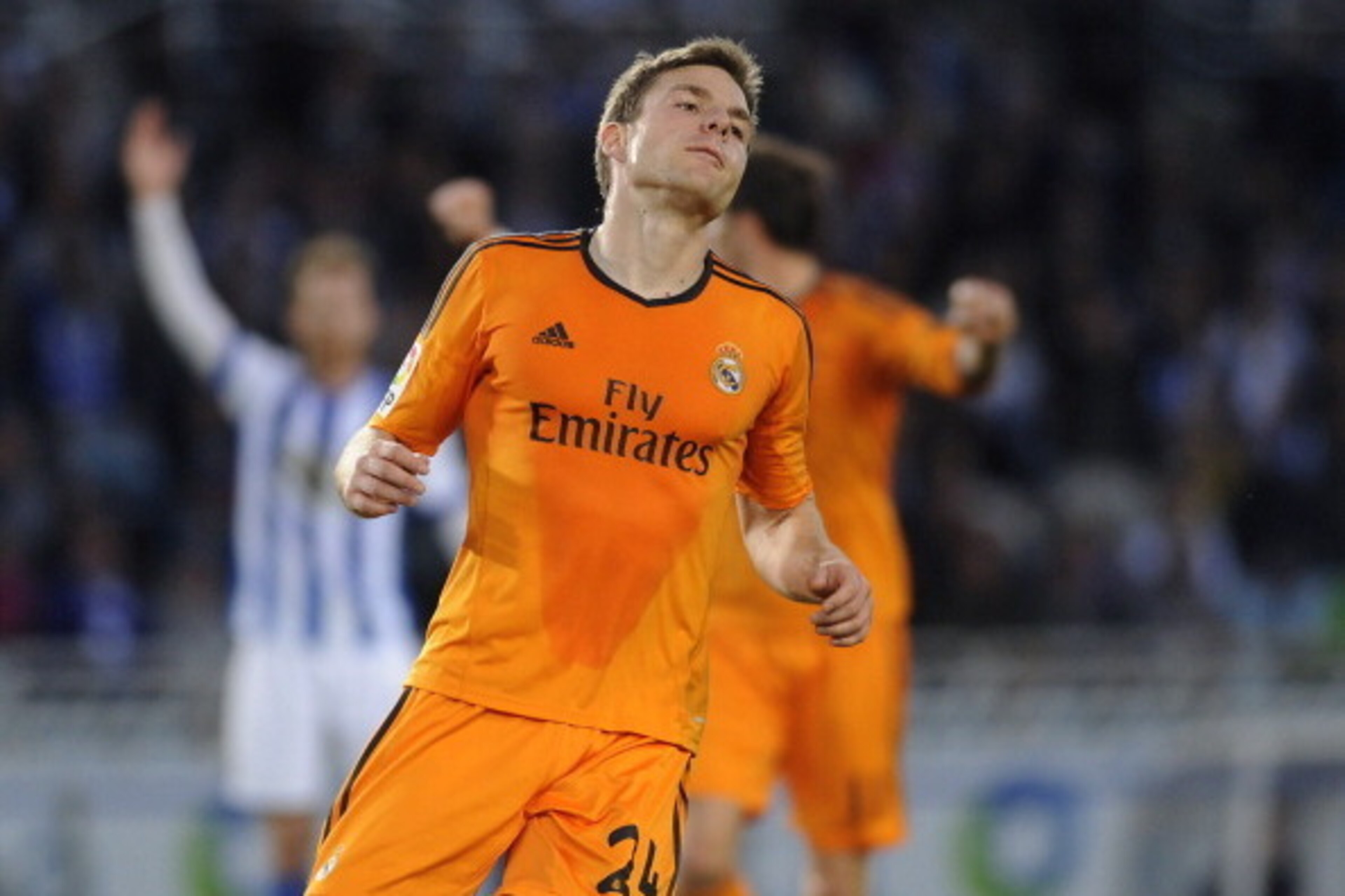 Real Madrid's midfielder Asier Illarramendi (L) celebrates after scoring during the Spanish league football match Real Sociedad vs Real Madrid CF at the Anoeta stadium in San Sebastian on April 5, 2014.  AFP PHOTO / ANDER GILLENEA        (Photo credit sho
