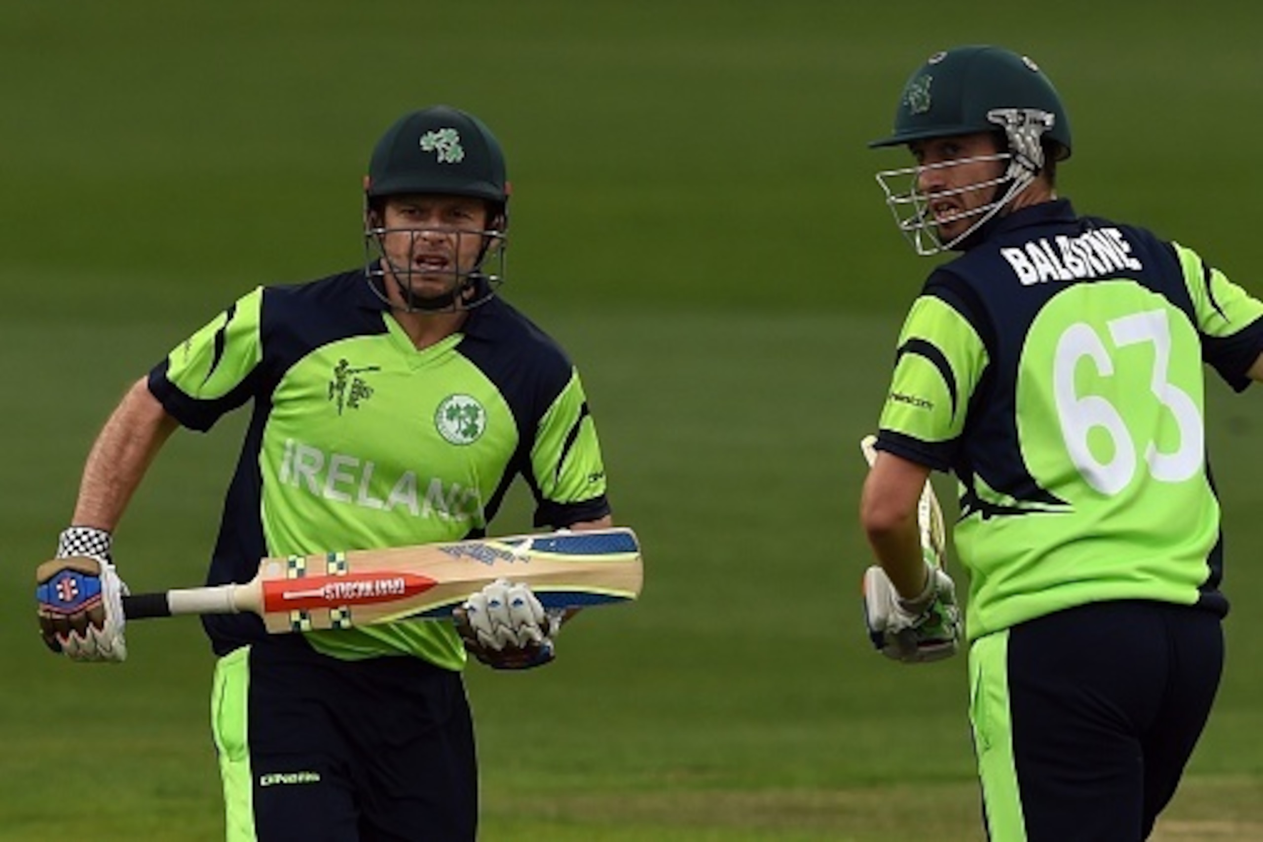 Ireland batsman Ed Joyce (L) and teammate Andrew Balbirnie takes a run at the Bellerive Oval ground during the 2015 Cricket World Cup Pool B match between Ireland and Zimbabwe in Hobart on March 7, 2015.  AFP PHOTO / INDRANIL MUKHERJEE  -- IMAGE RESTRICTE