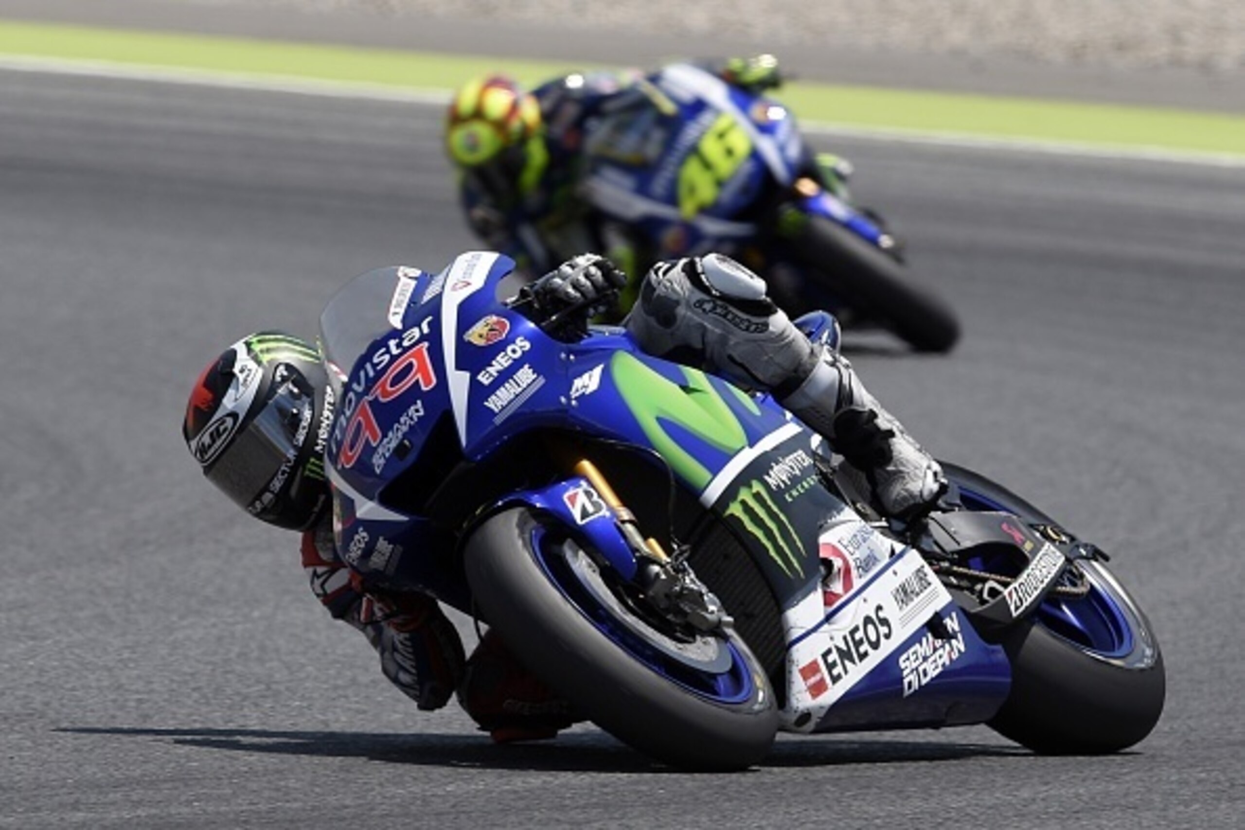 Movistar Yamaha MotoGP's Spanish rider Jorge Lorenzo (L) competes ahead of Movistar Yamaha MotoGP's Italian rider Valentino Rossi (R) during the Catalunya Moto GP race of the Catalunya Grand Prix at the Barcelona-Catalunya racetrack in Montmelo, near Barc Movistar Yamaha MotoGP's Spanish rider Jorge Lorenzo (L) competes ahead of Movistar Yamaha MotoGP's Italian rider Valentino Rossi (R) during the Catalunya Moto GP race of the Catalunya Grand Prix at the Barcelona-Catalunya racetrack in Montmelo, near Barc