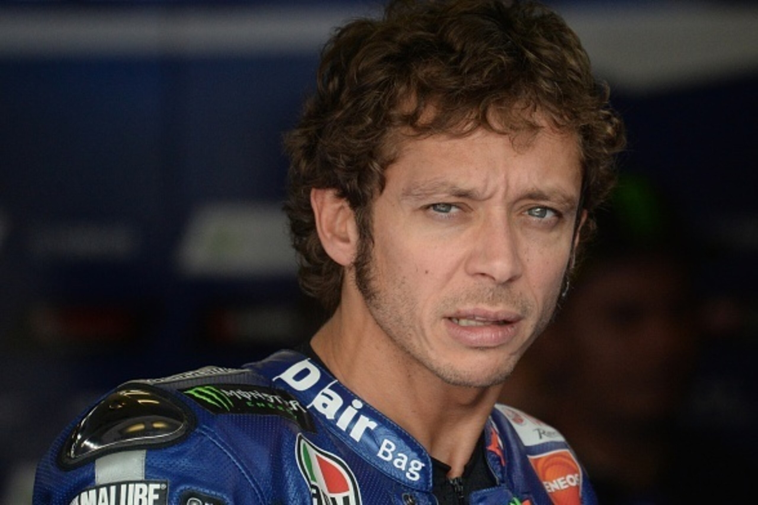 Movistar Yamaha MotoGP's Italian rider Valentino Rossi looks on in the paddock on the start of the second free practice session of the Moto GP Czech Grand Prix in Brno, Czech Republic, on August 14, 2015. The Czech Grand Prix race will take place on Augus Movistar Yamaha MotoGP's Italian rider Valentino Rossi looks on in the paddock on the start of the second free practice session of the Moto GP Czech Grand Prix in Brno, Czech Republic, on August 14, 2015. The Czech Grand Prix race will take place on Augus