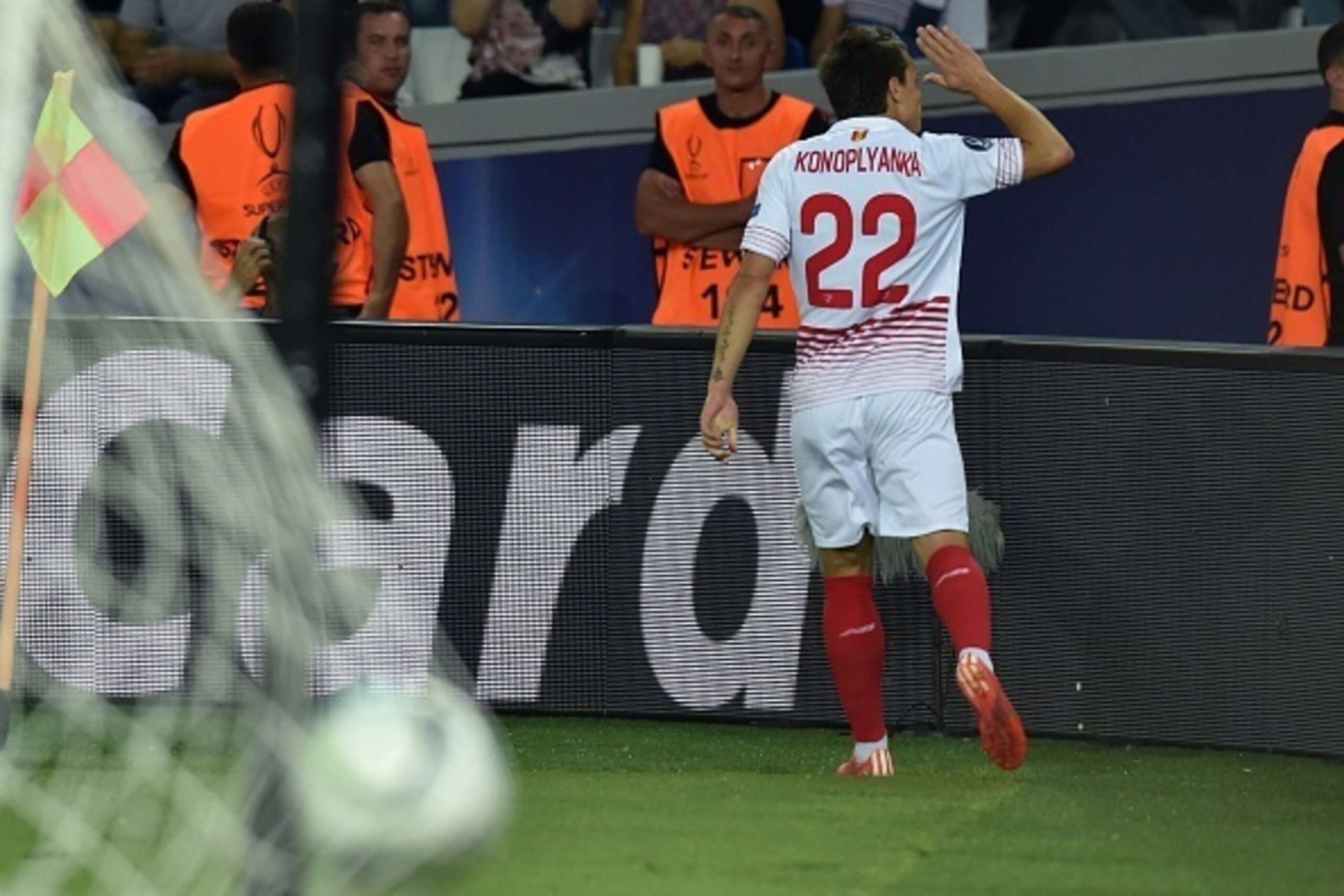 Sevilla's Ukrainian midfielder Yevhen Konoplyanka celebrates after scoring a goal during the UEFA Super Cup final football match between FC Barcelona and Sevilla FC on August 11, 2015 at the Boris Paichadze Dinamo Arena in Tbilisi. AFP PHOTO / KIRILL KUDR