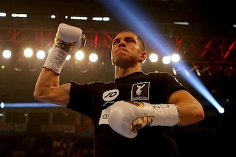 MANCHESTER, ENGLAND - JULY 18: Scott Quigg arrives in the ring ahead of his fight against Kiko Martinez during their WBA World Super Bantamweight Championship contest at the Manchester Arena on July 18, 2015 in Manchester, England. (Photo by Dave Thompson