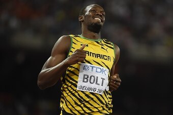 Jamaica's Usain Bolt competes in a semi-final heat of the men's 200 metres athletics event at the 2015 IAAF World Championships at the 'Bird's Nest' National Stadium in Beijing on August 26, 2015. AFP PHOTO / OLIVIER MORIN        (Photo credit should read
