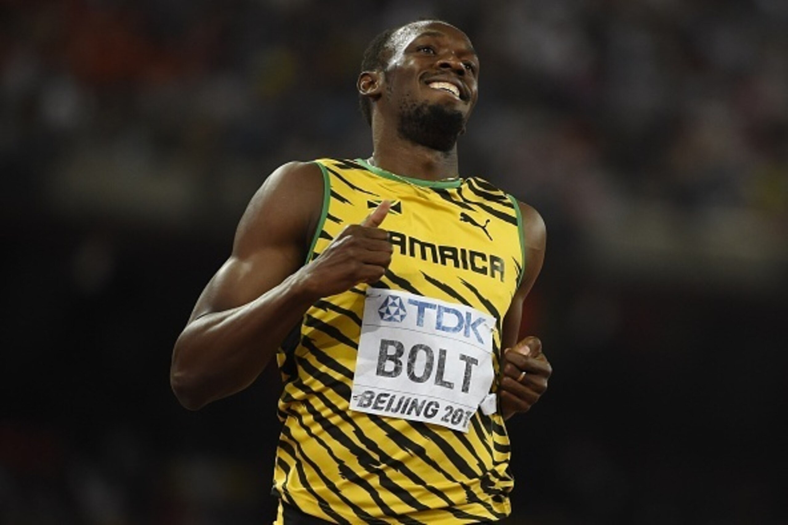 Jamaica's Usain Bolt competes in a semi-final heat of the men's 200 metres athletics event at the 2015 IAAF World Championships at the 'Bird's Nest' National Stadium in Beijing on August 26, 2015. AFP PHOTO / OLIVIER MORIN (Photo credit should read Jamaica's Usain Bolt competes in a semi-final heat of the men's 200 metres athletics event at the 2015 IAAF World Championships at the 'Bird's Nest' National Stadium in Beijing on August 26, 2015. AFP PHOTO / OLIVIER MORIN (Photo credit should read