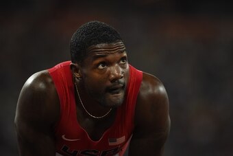 USA's Justin Gatlin looks at the results after competing in a semi-final heat of the men's 200 metres athletics event at the 2015 IAAF World Championships at the 'Bird's Nest' National Stadium in Beijing on August 26, 2015. AFP PHOTO / OLIVIER MORIN      