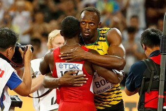 BEIJING, CHINA - AUGUST 23:  Usain Bolt of Jamaica is congratulated by Justin Gatlin of the United States after winning gold in the Men's 100 metres final during day two of the 15th IAAF World Athletics Championships Beijing 2015 at Beijing National Stadi