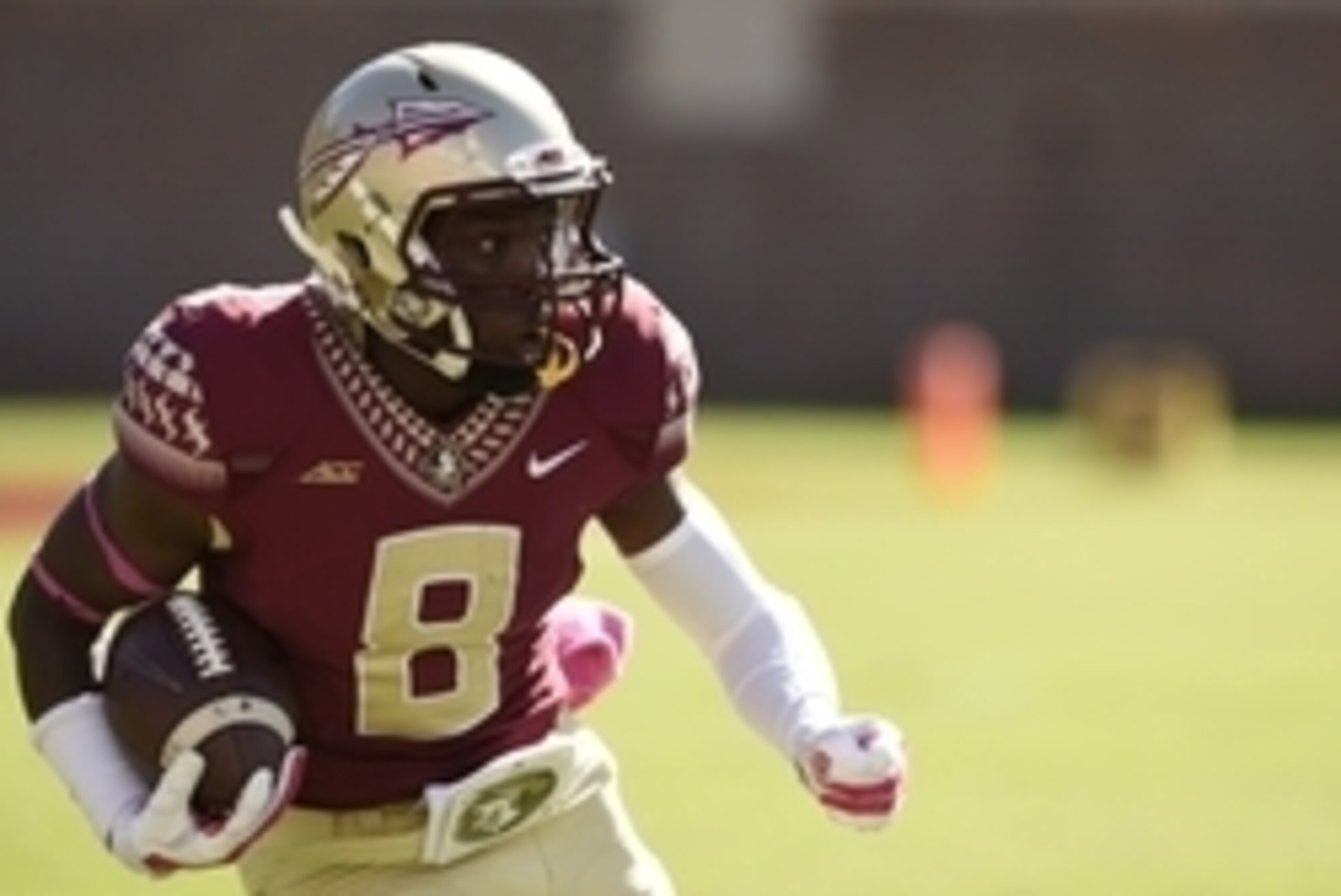 Oct 4, 2014; Tallahassee, FL, USA; Florida State Seminoles wide receiver Kermit Whitfield (8) returns the ball up the field against the Wake Forest Demon Deacons at Doak Campbell Stadium. Mandatory Credit: John David Mercer-USA TODAY Sports