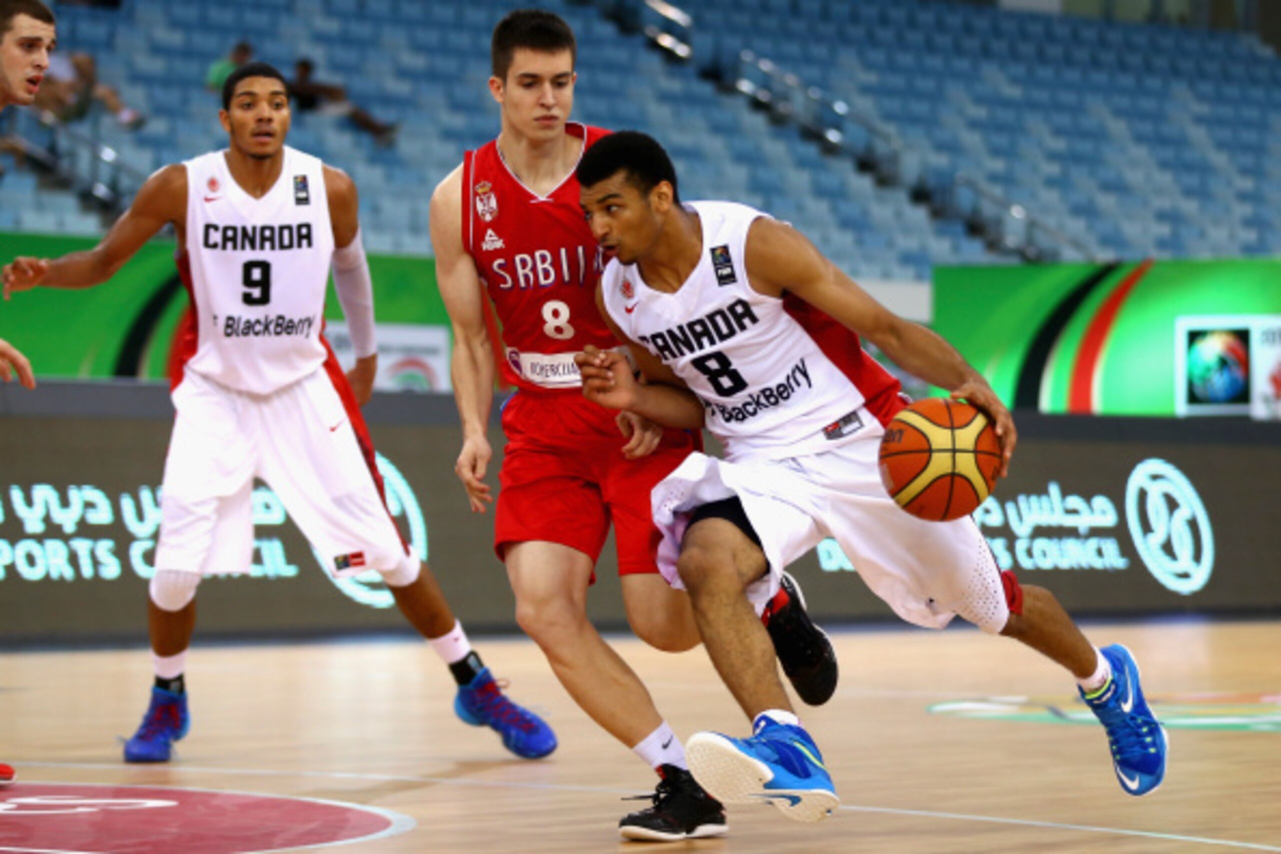 DUBAI, UNITED ARAB EMIRATES - AUGUST 14: Jamal Murray  of Canada controls the ball against Slobodan Jovanovic of Serbia during the FIBA U17 World Championships Quarter-Final match between  Canada and Serbia at the Hamdan Sports Complex on August 14, 2014 