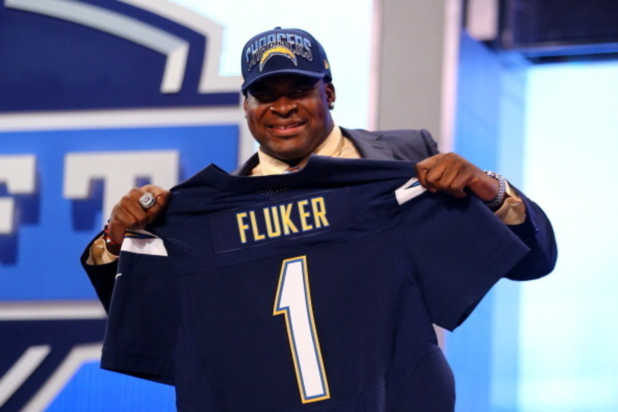 NEW YORK, NY - APRIL 25: D.J. Fluker of the Alabama Crimson Tide holds up a jersey on stage after he was picked #11 overall by the San Diego Chargers in the first round of the 2013 NFL Draft at Radio City Music Hall on April 25, 2013 in New York City. ( NEW YORK, NY - APRIL 25: D.J. Fluker of the Alabama Crimson Tide holds up a jersey on stage after he was picked #11 overall by the San Diego Chargers in the first round of the 2013 NFL Draft at Radio City Music Hall on April 25, 2013 in New York City. (
