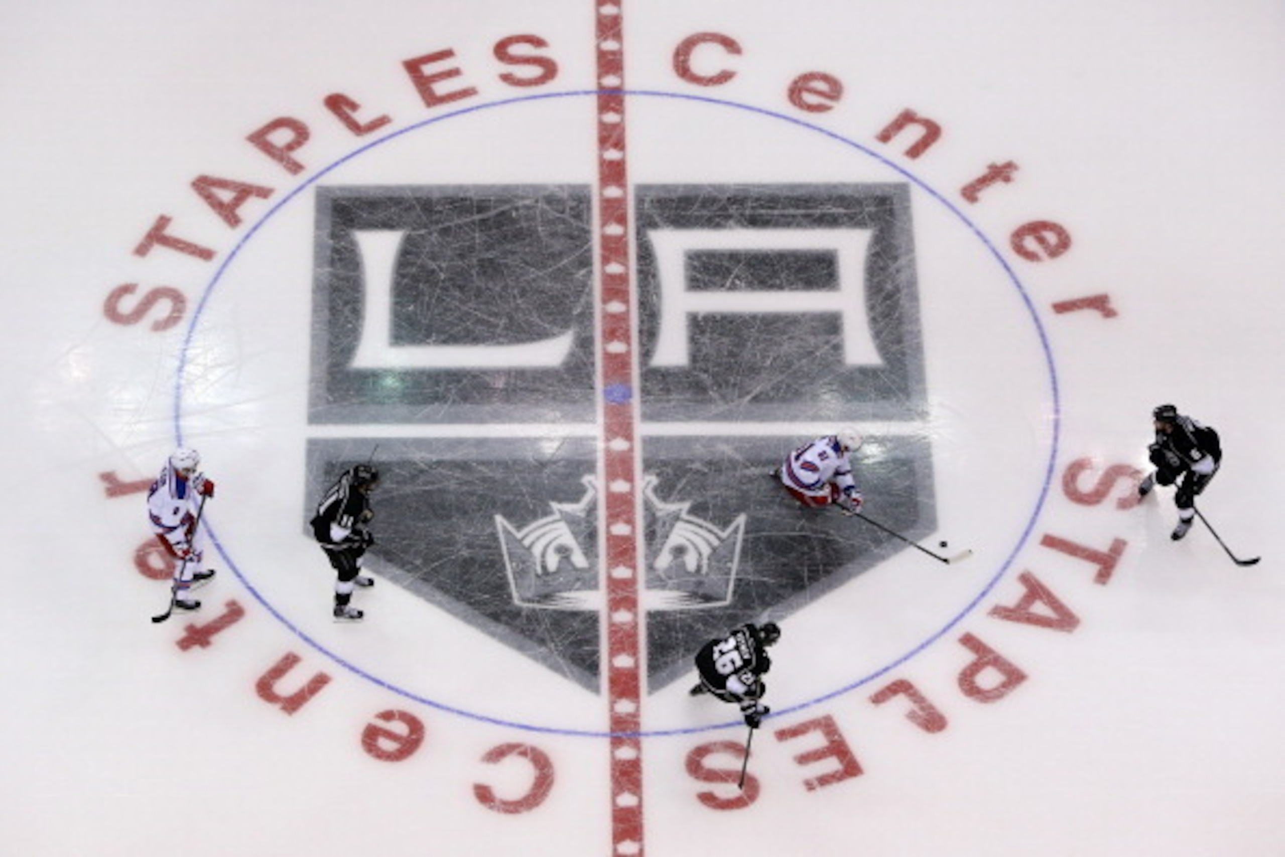 LOS ANGELES, CA - JUNE 04: The New York Rangers skate over the center ice logo against the Los Angeles Kings during Game One of the 2014 NHL Stanley Cup Final at the Staples Center on June 4, 2014 in Los Angeles, California. (Photo by Victor Decolongon/ LOS ANGELES, CA - JUNE 04: The New York Rangers skate over the center ice logo against the Los Angeles Kings during Game One of the 2014 NHL Stanley Cup Final at the Staples Center on June 4, 2014 in Los Angeles, California. (Photo by Victor Decolongon/