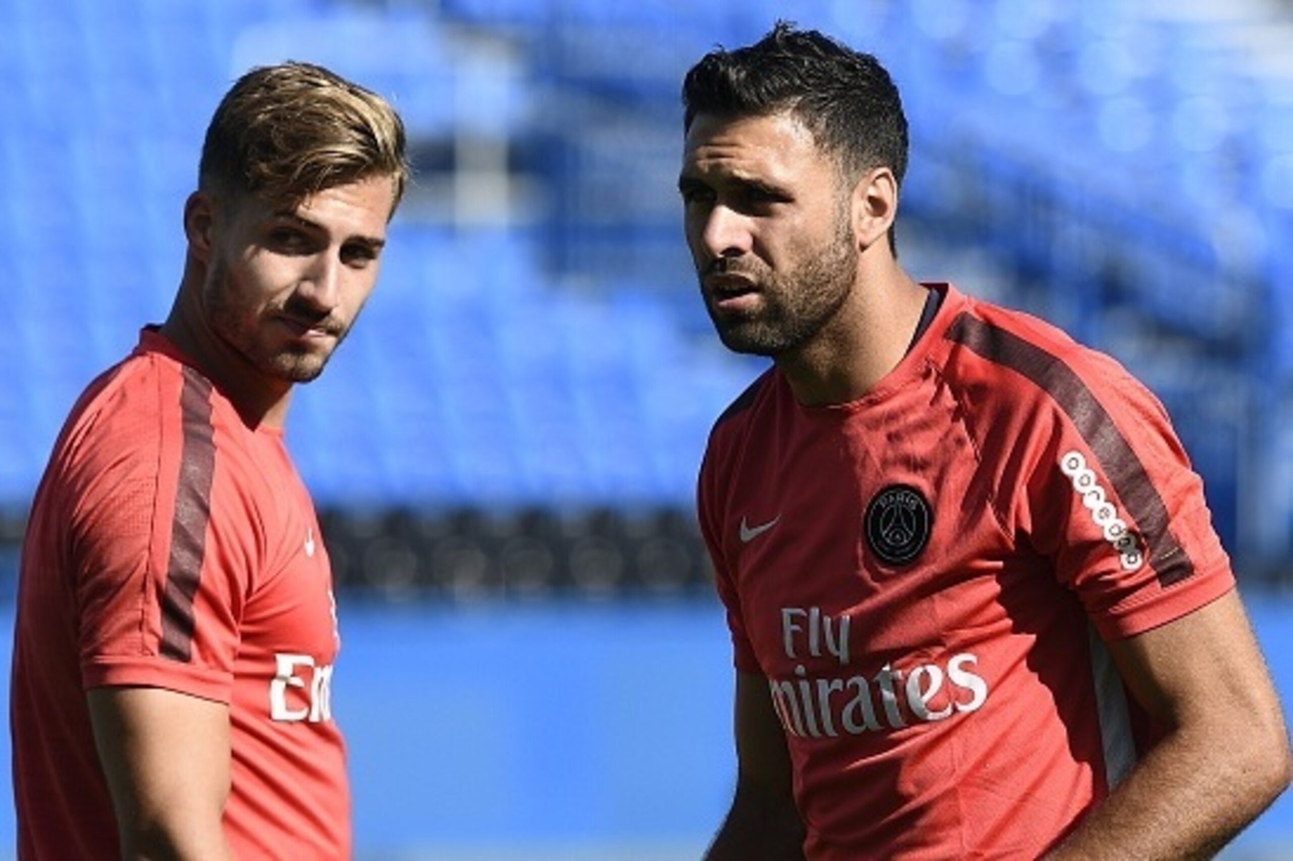 Paris Saint-Germain's German goalkeeper Kevin Trapp (L) walks past Italian goalkeeper Salvatore Sirigu during a training session  at Saputo stadium in Montreal on July 31, 2015 on the eve of the French Trophy of Champions football match against Lyon.  AFP