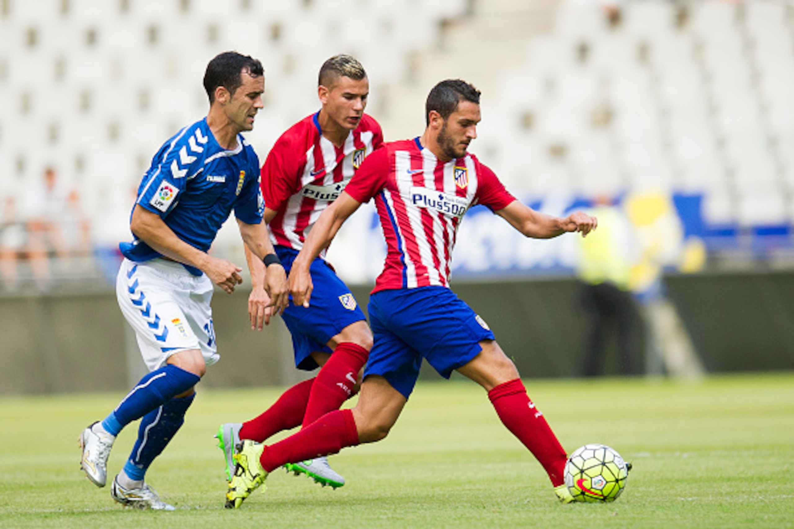 OVIEDO, SPAIN - JULY 28:  Jorge Resurreccion 'Koke' of Club Atletico de Madrid duels for the ball with Miguel Linares of Real Oviedo during a pre season friendly match between Real Oviedo and Club Atletico de Madrid at Carlos Tartiere on July 28, 2015 in 