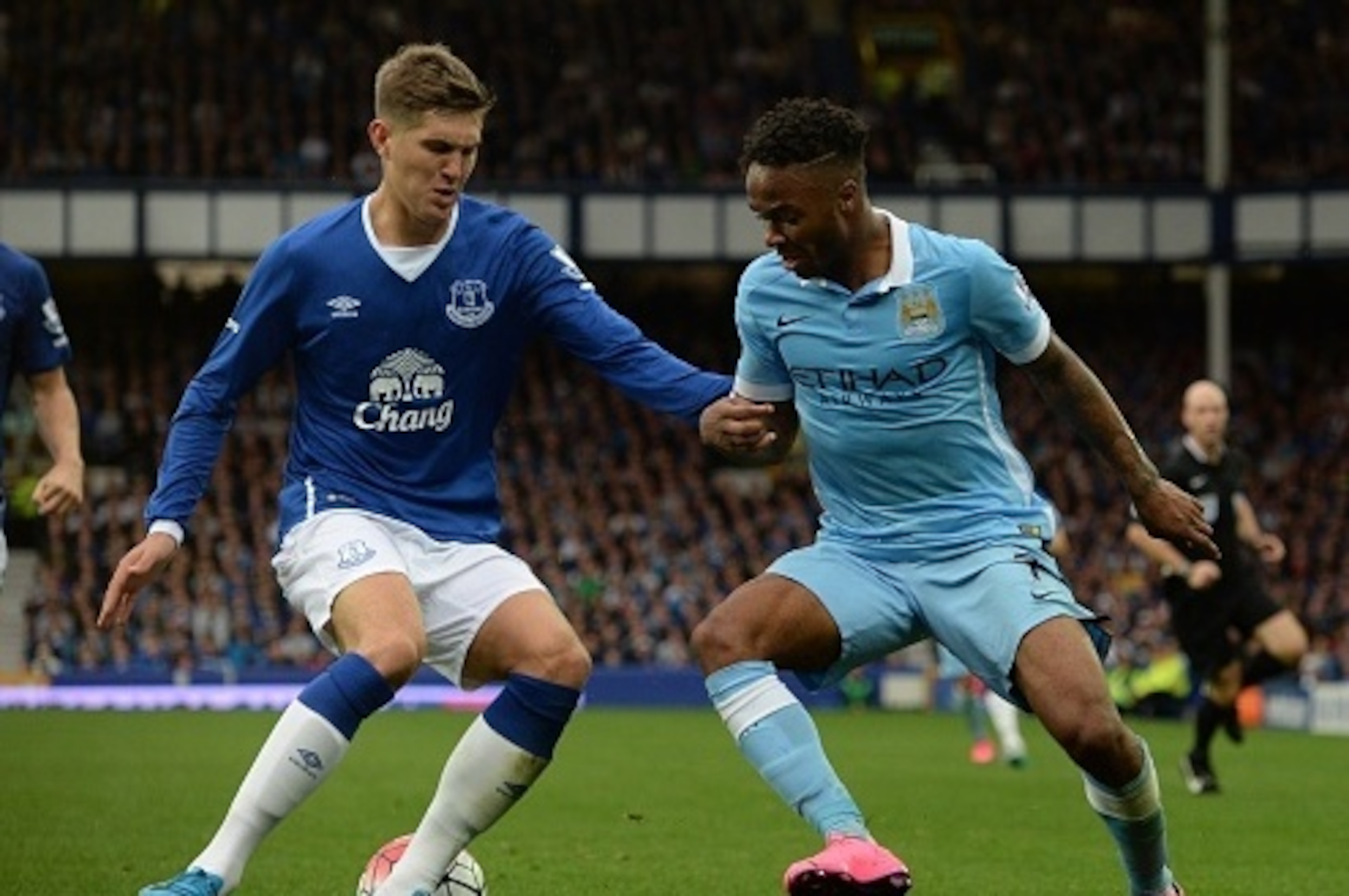Everton's English defender John Stones (L) vies with Manchester City's English midfielder Raheem Sterling during the English Premier League football match between Everton and Manchester City at Goodison Park in Liverpool on August 23, 2015. AFP PHOTO / OL