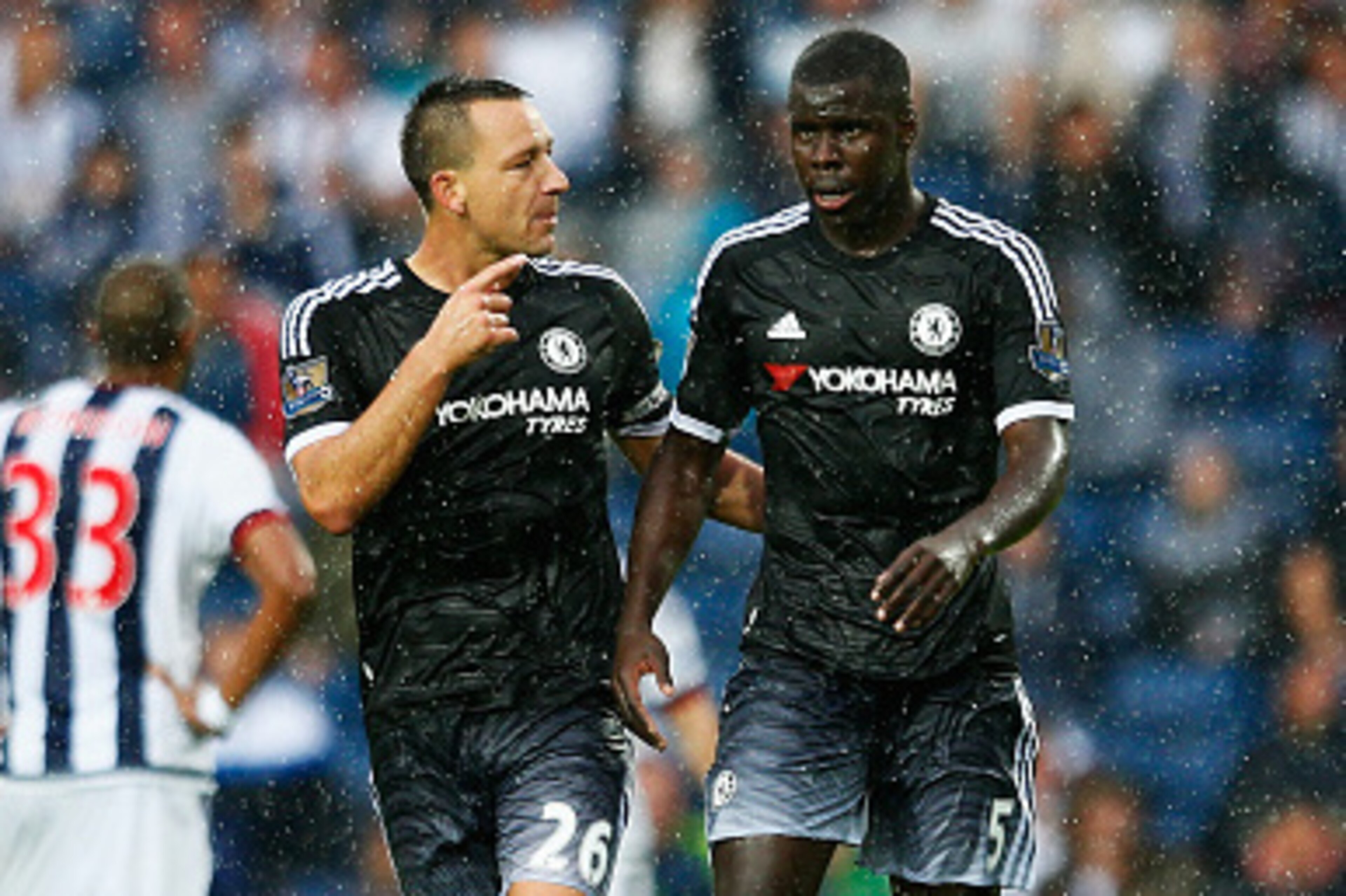 WEST BROMWICH, ENGLAND - AUGUST 23:  John Terry of Chelsea talks to Kurt Zouma of Chelsea during the Barclays Premier League match between West Bromwich Albion and Chelsea at The Hawthorns on August 23, 2015 in West Bromwich, England.  (Photo by Julian Fi